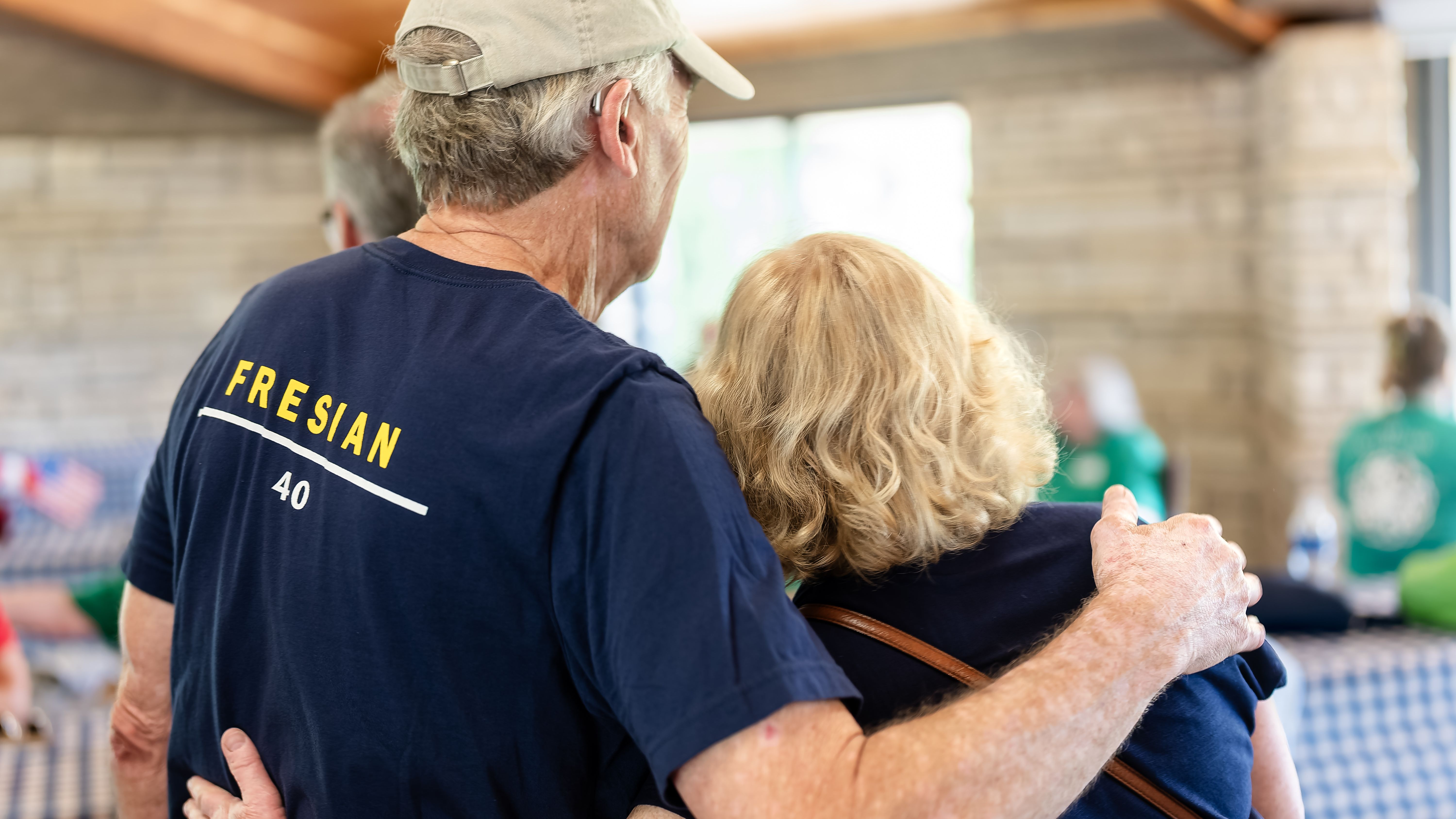 A pair of the author's relatives hugging at a family reunion.