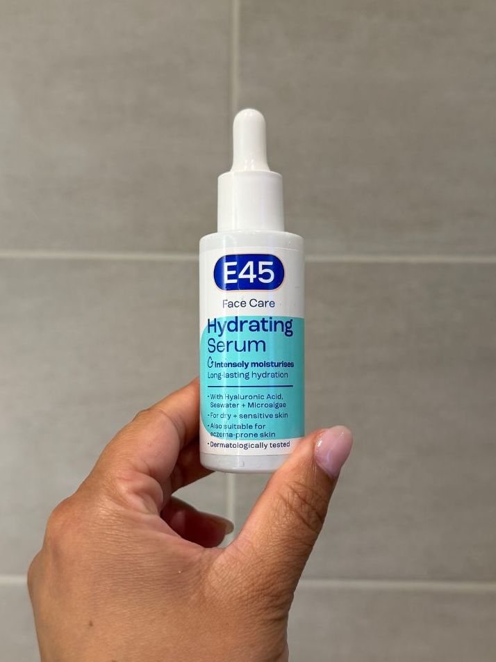 Aleesha holding empty E45 Hydrating Serum