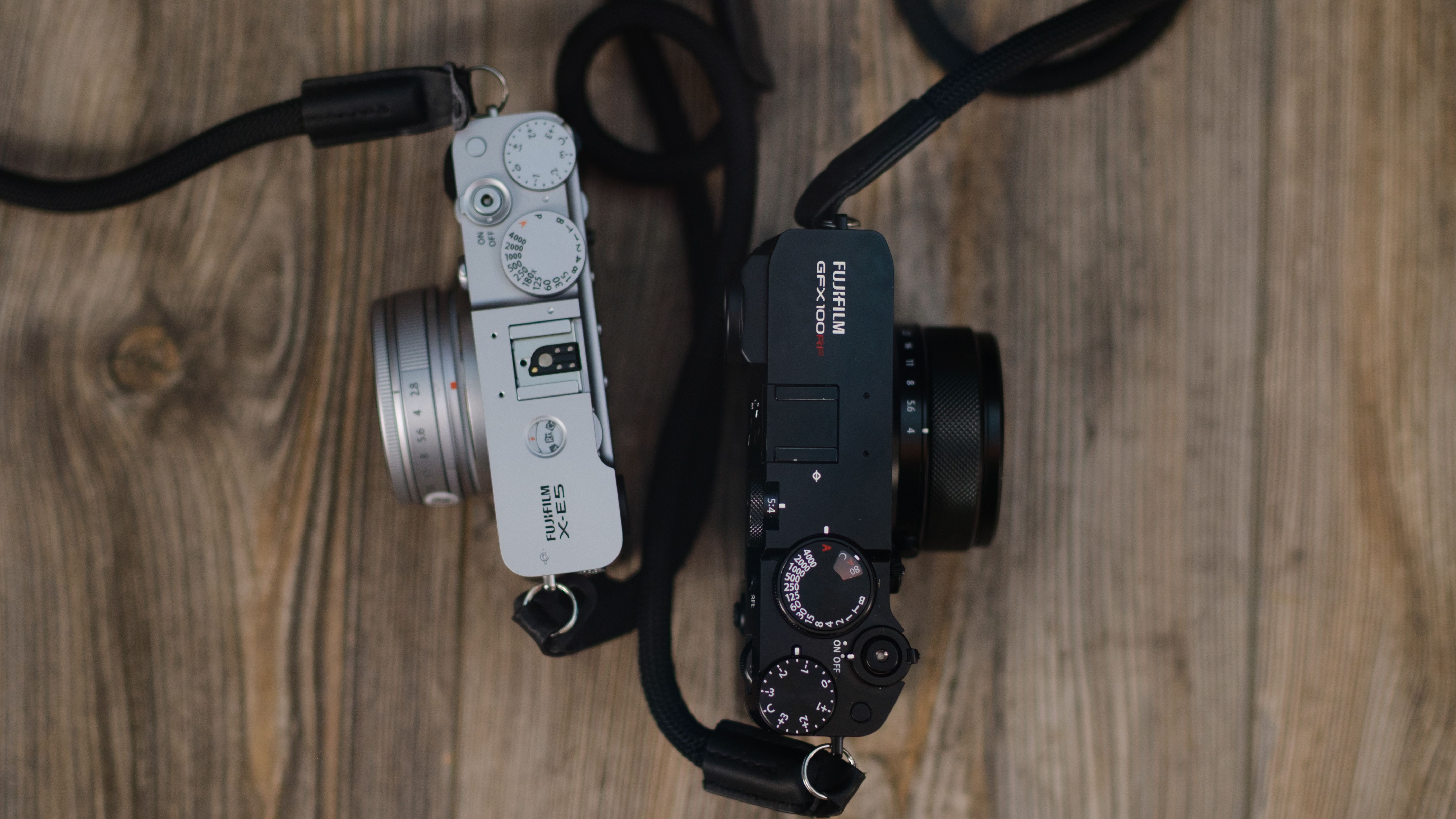 The Fujifilm X-E5 (silver) and GFX100RF (black)