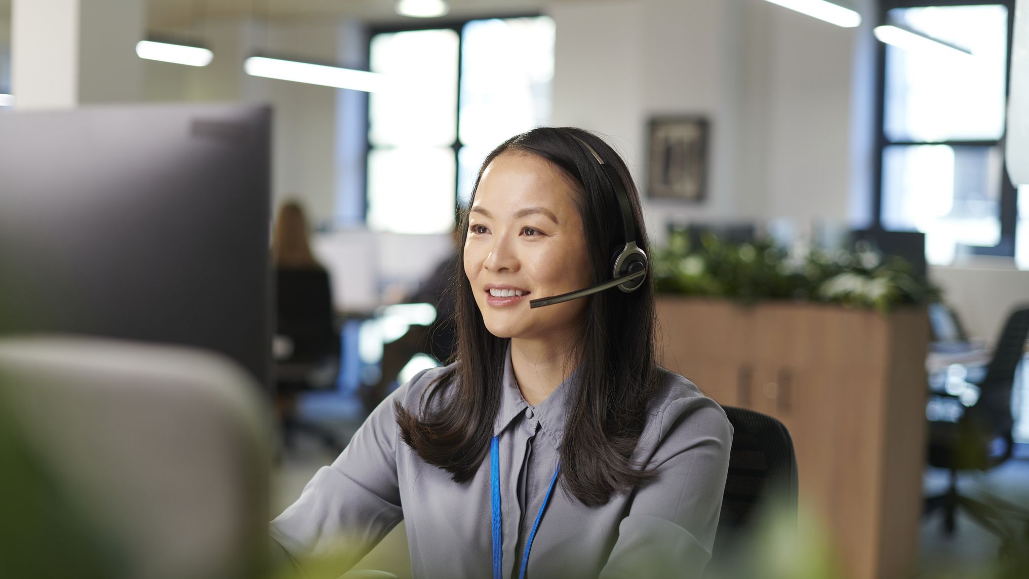Happy call handler helping a customer