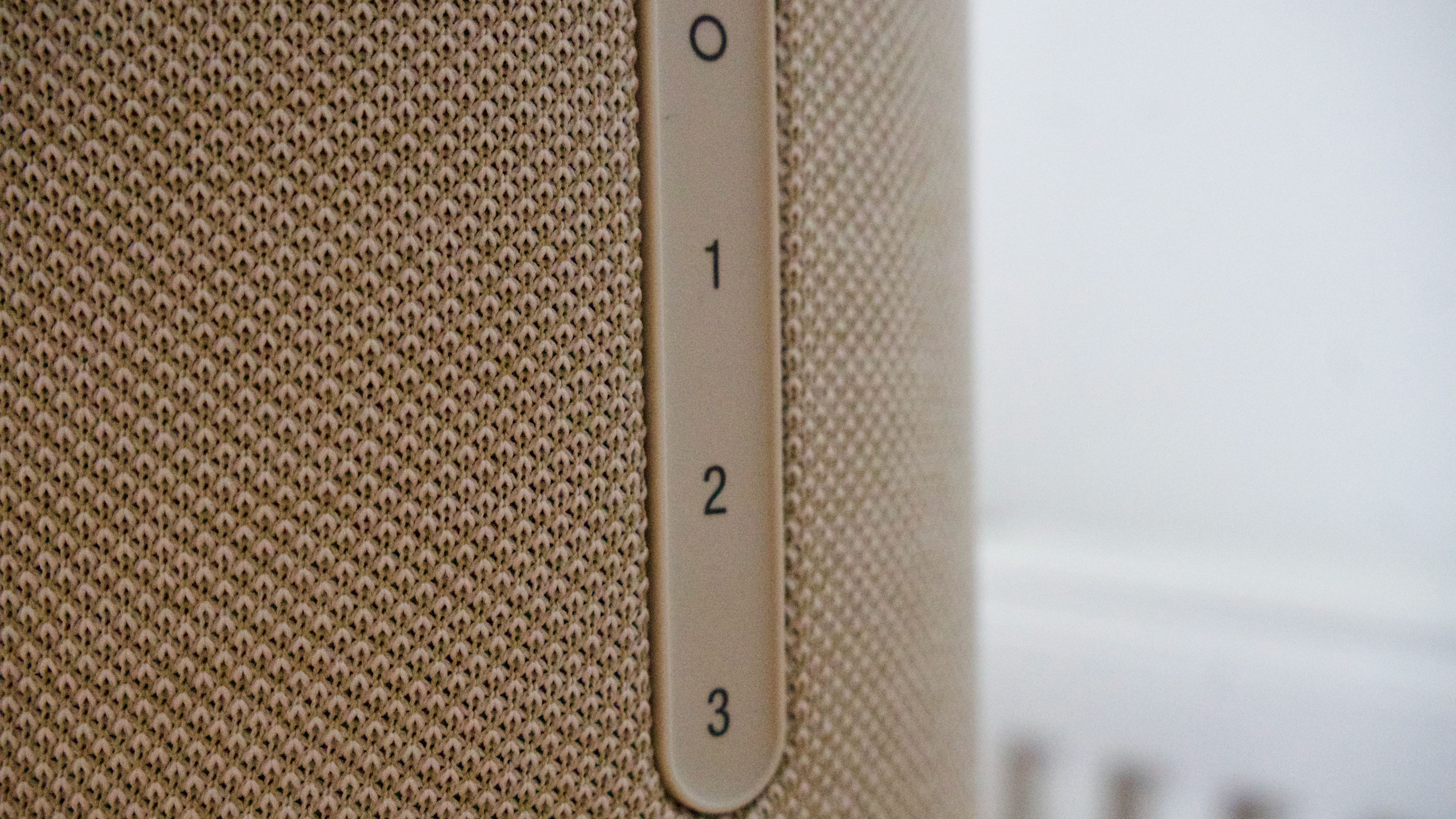 Close-up of the Denon Home 400 home speaker radio preset side panel