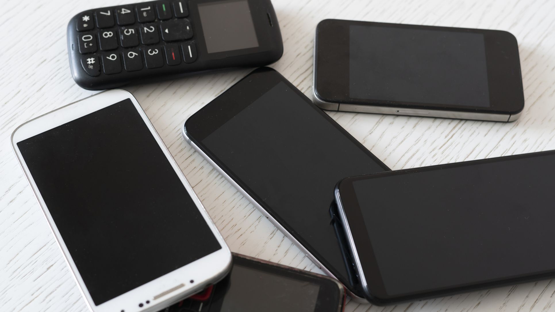 Technology evolution concept, some old vintage phone cell phones and new modern devices