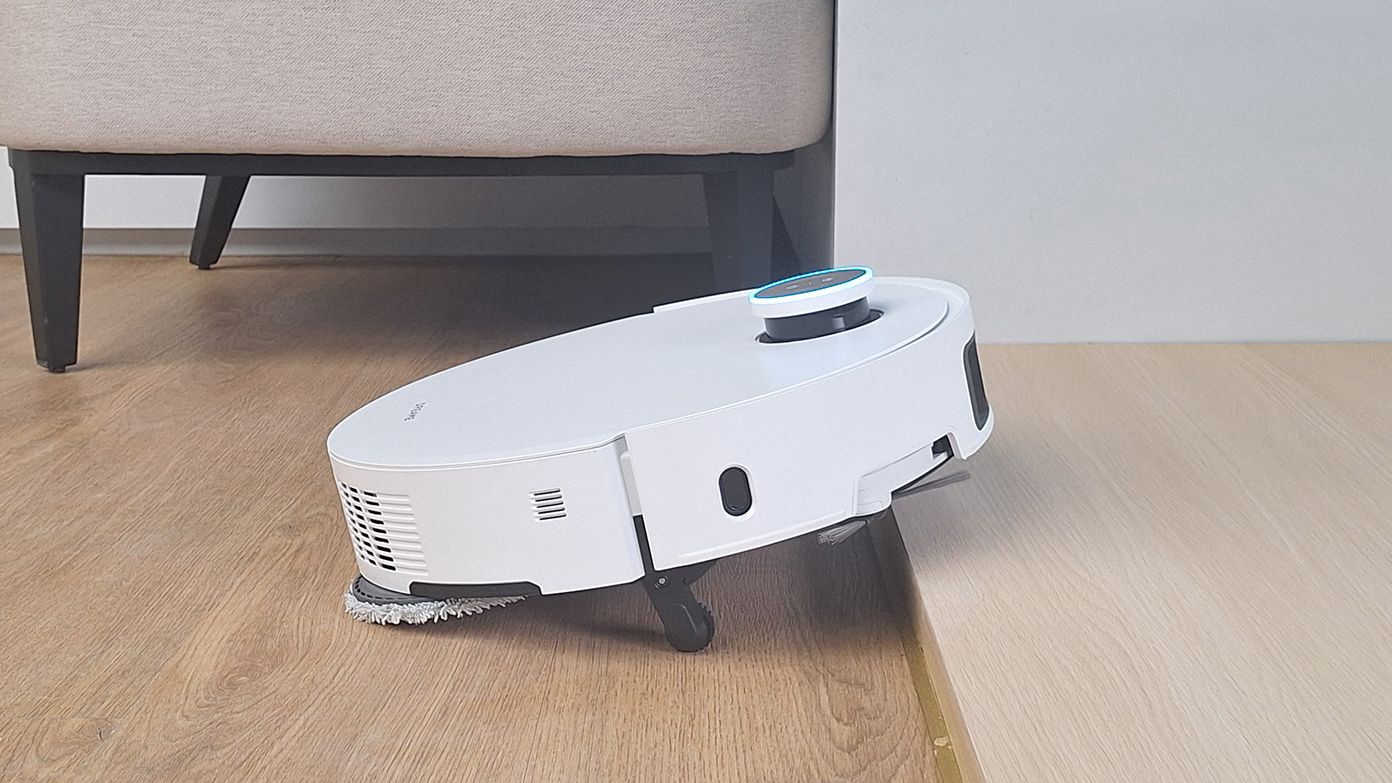 Dreame X50 Ultra robot vacuum climbing over a step