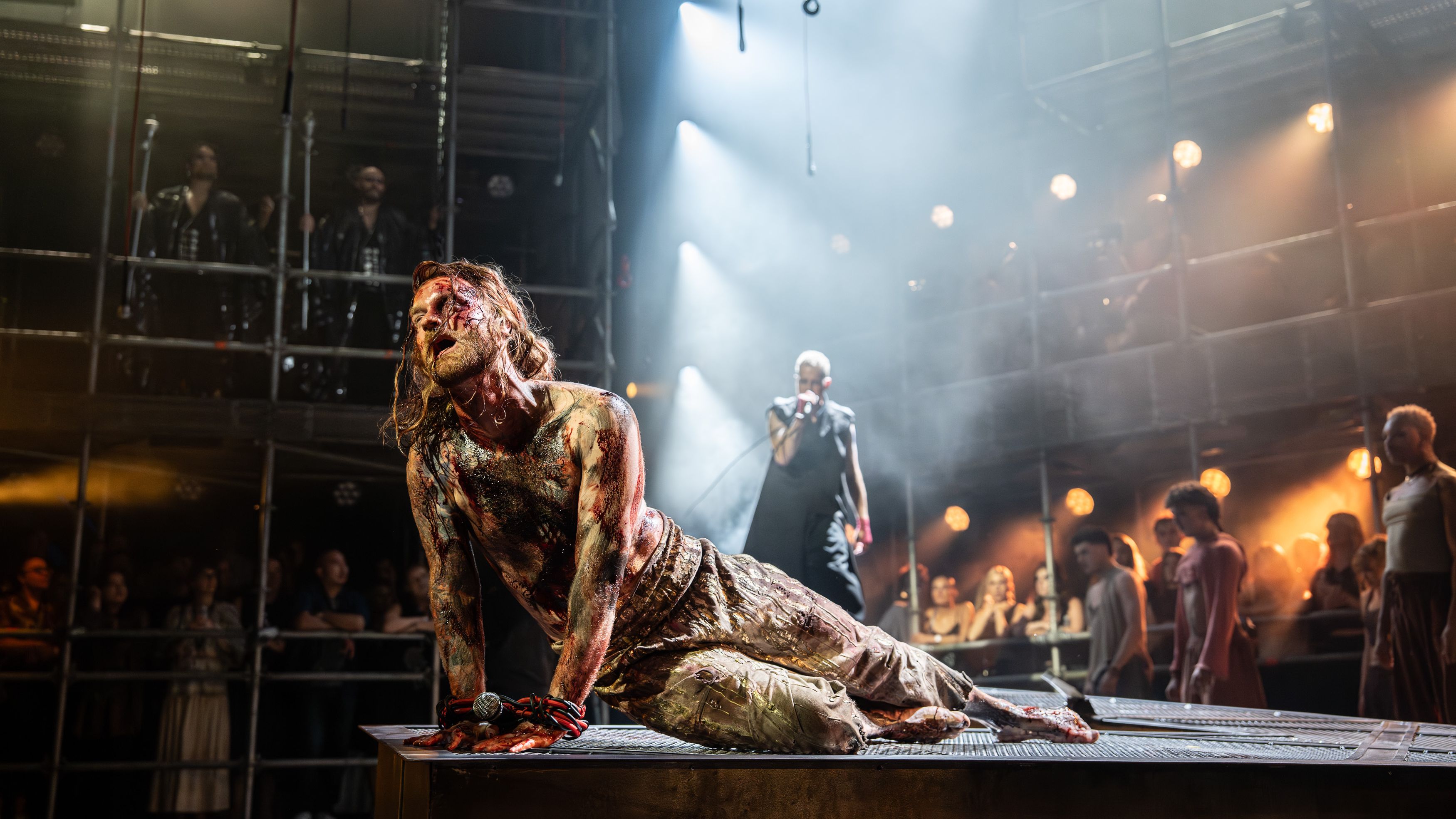 an image of Sam Ryder onstage during Jesus Christ Superstar as Jesus during the crucifixion scene