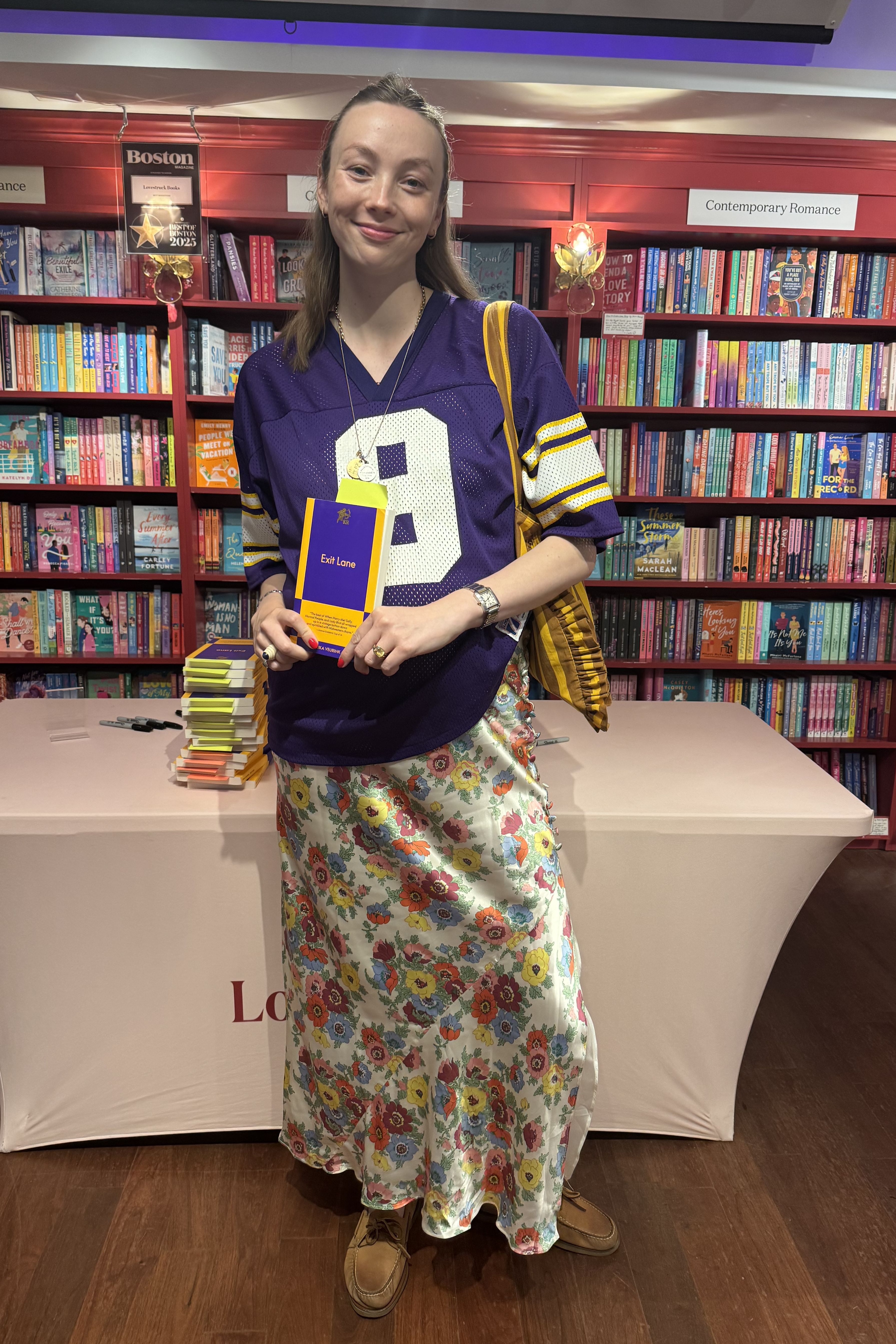 Erika Veurink wearing a sports jersey with a floral skirt and boat shoes