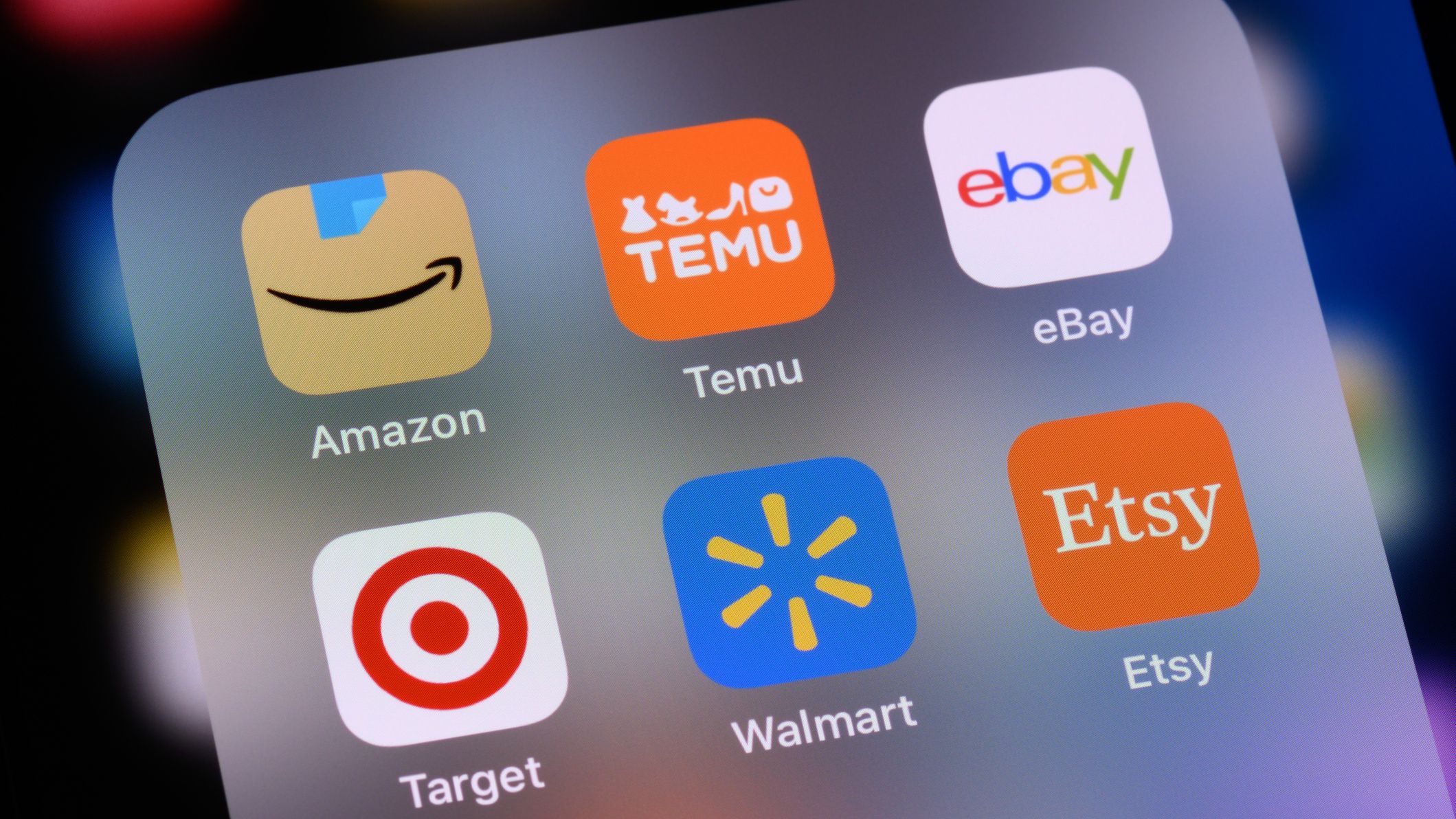 Amazon, Walmart and other shopping apps on a phone.