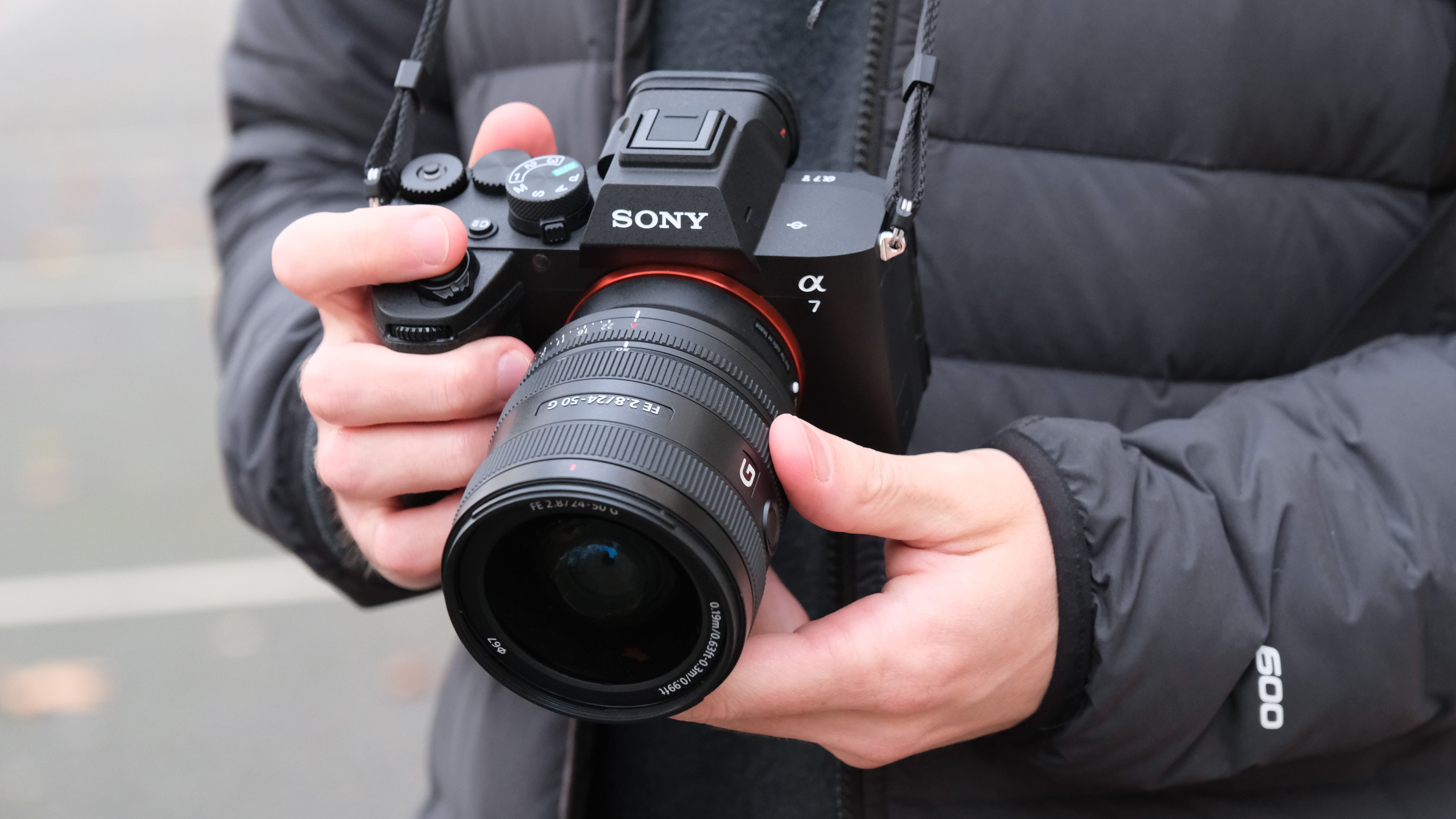 Sony A7 V camera held in a person's hands