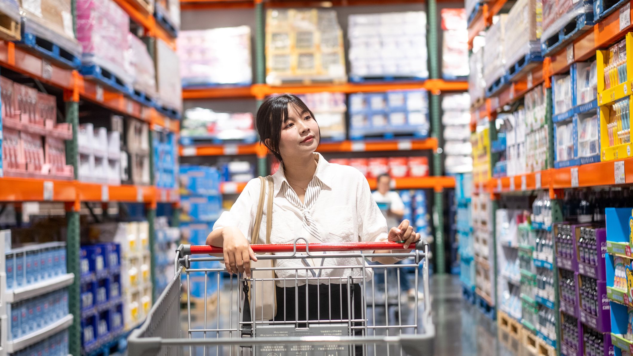 A woman shopping at a warehouse store.