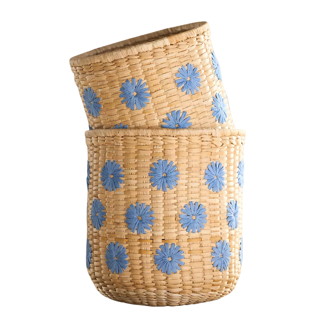 two woven storage baskets with blue floral details