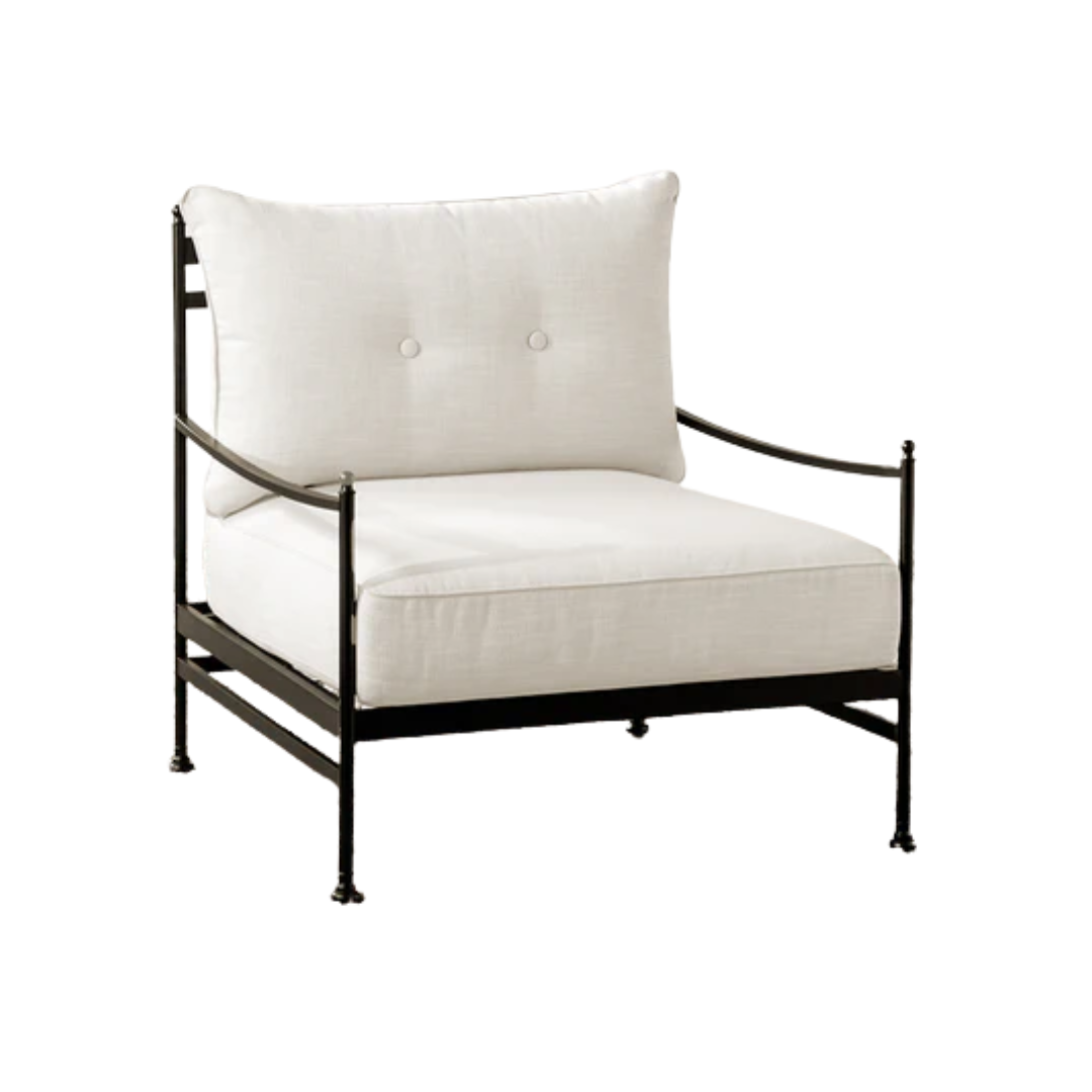 a deck chair with white cushions
