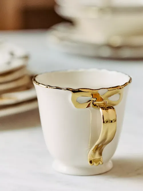 Benedita Bow Stoneware Gold Mug