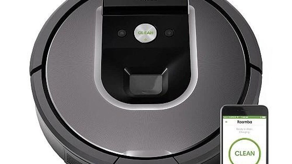 The iRobot Roomba 960 robot vacuum cleaner on sale for $500 cleans