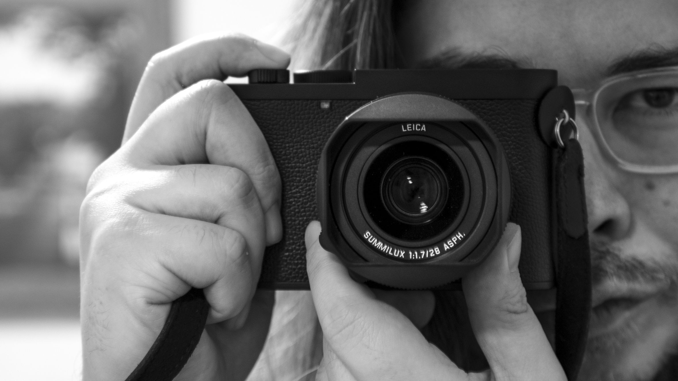 Photographer James Artaius holding a Leica Q3 Monochrom