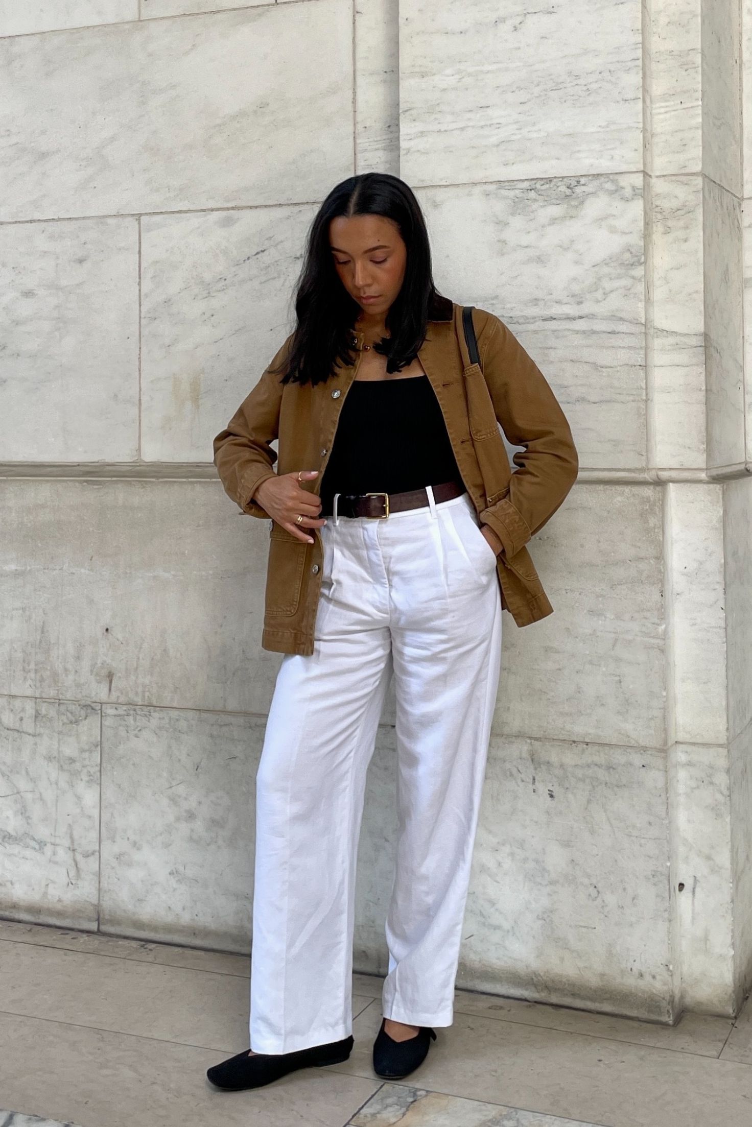 Lauren Tappan wearing a barn jacket and white jeans