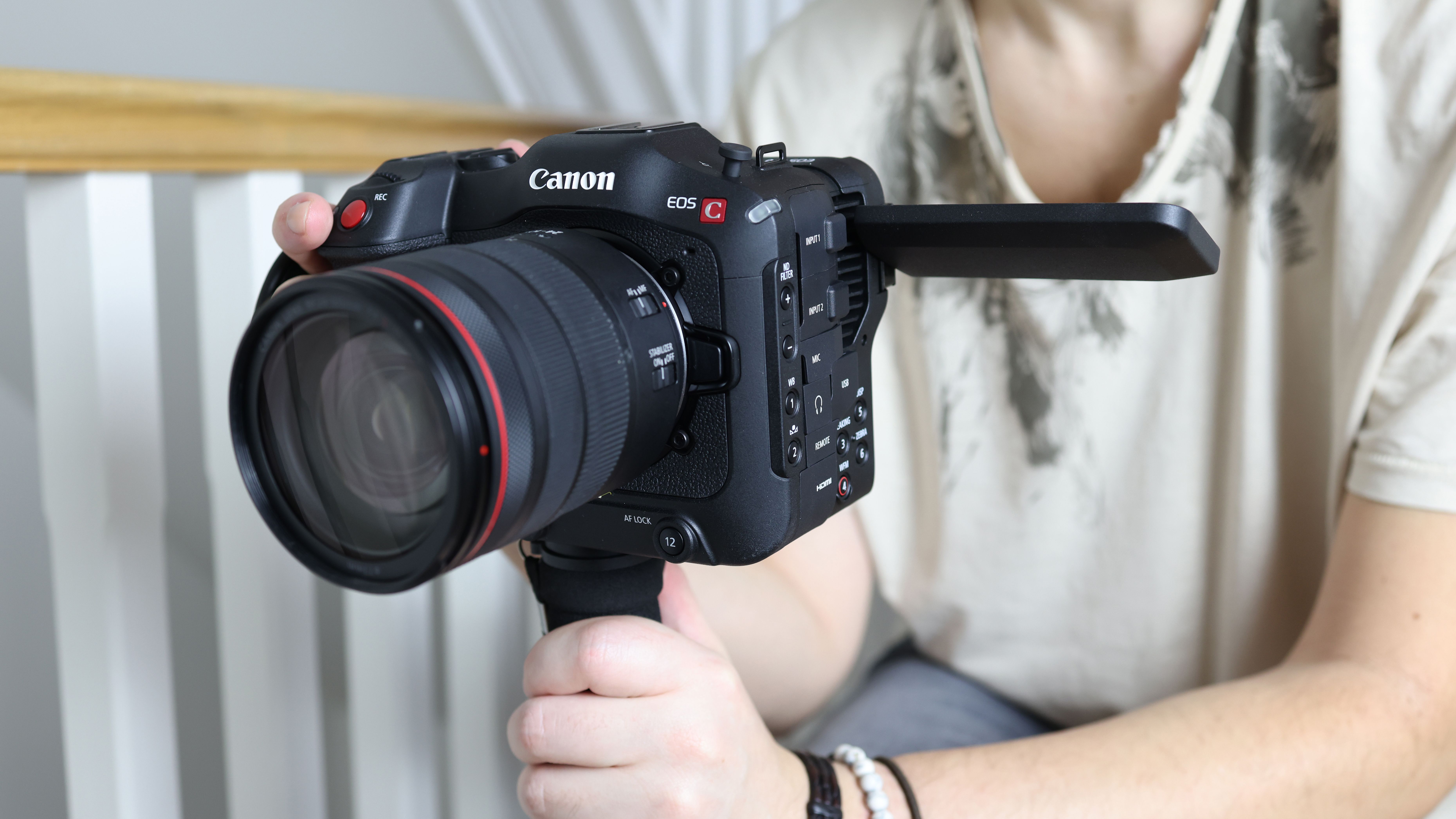Canon EOS C70 being held by one of our reviewers