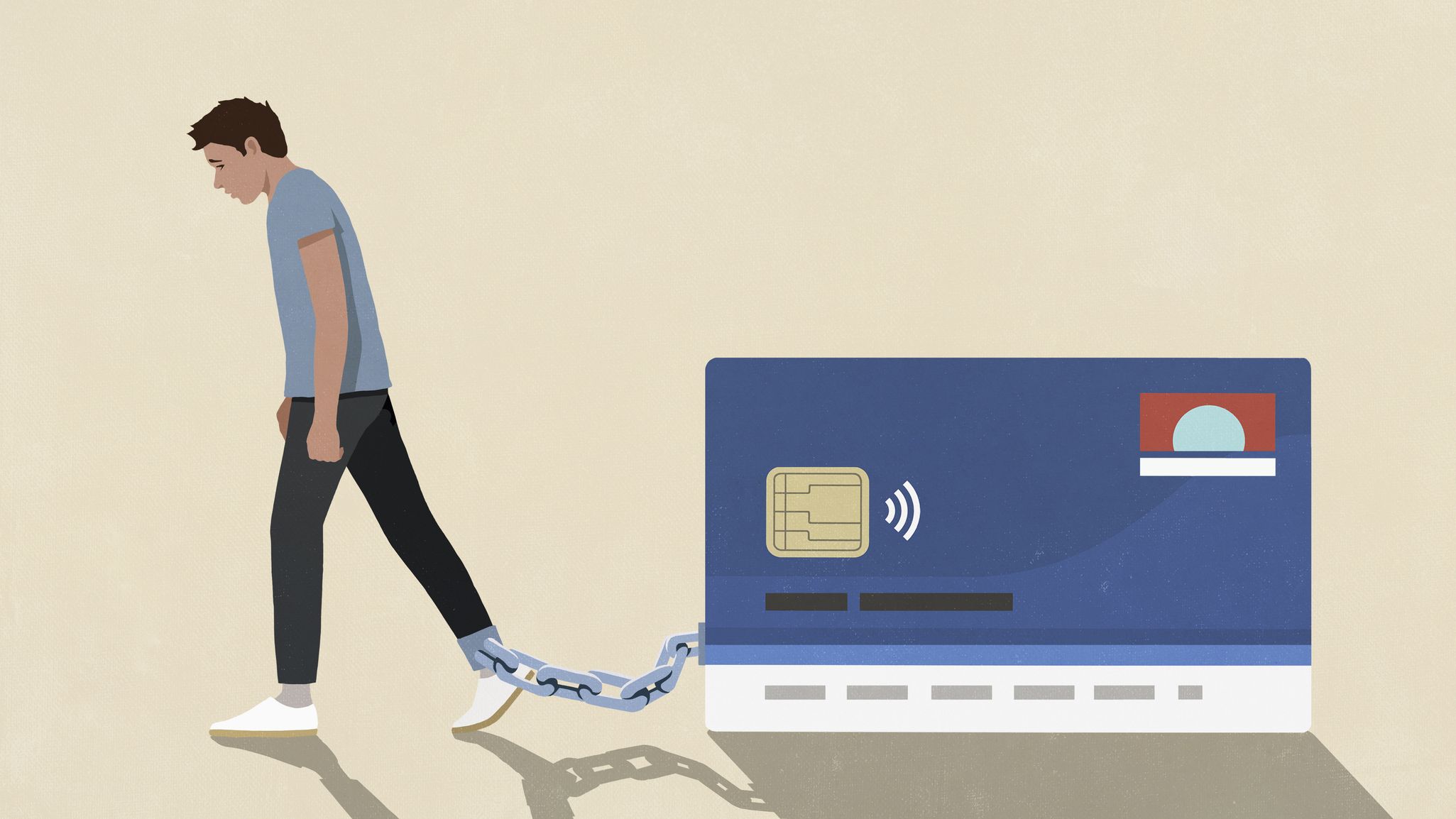 A man drags a credit card chained to his ankle, indicating he can't free himself from debt