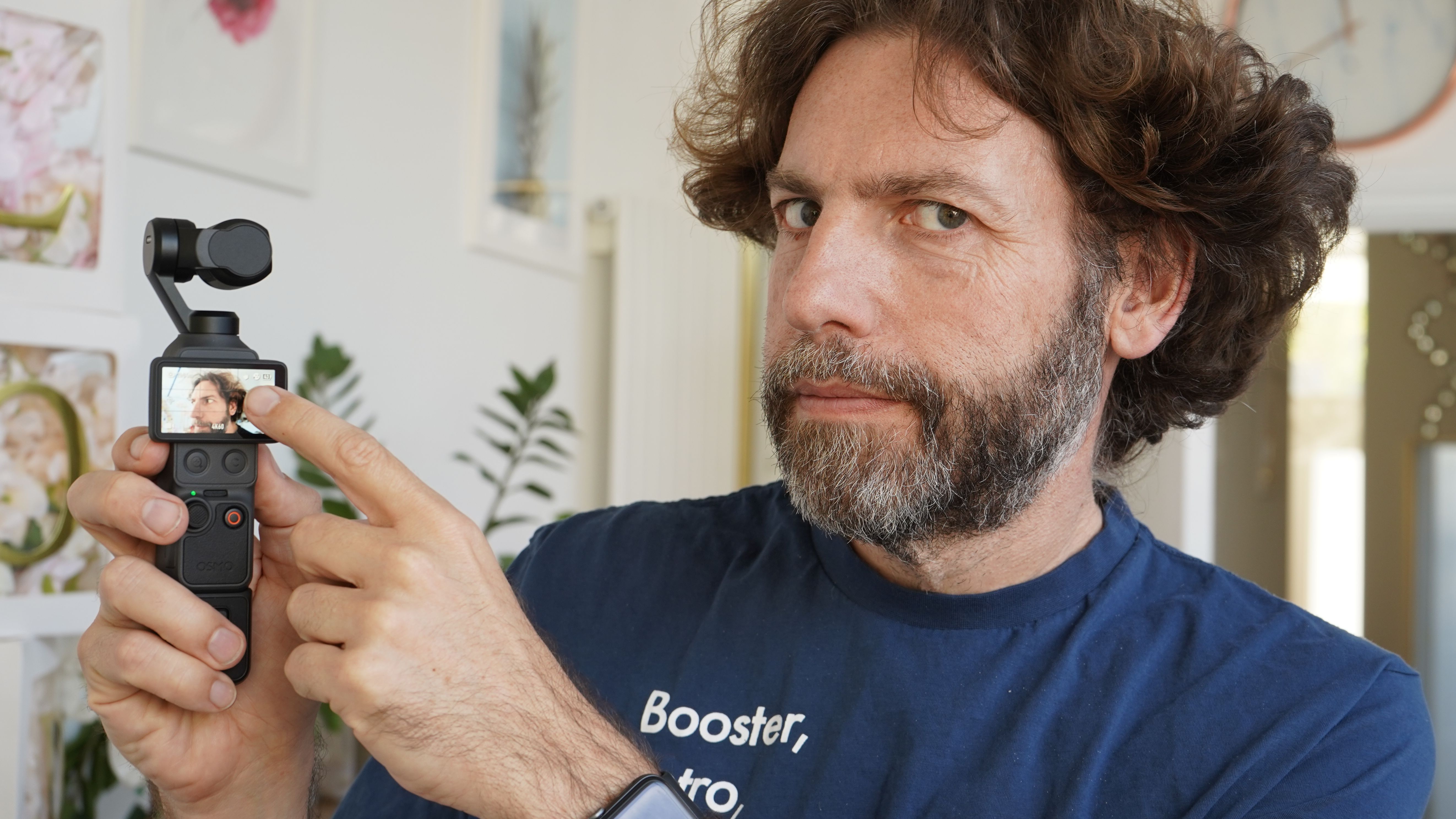 Adam pointing at the screen on the DJI Osmo Pocket 4