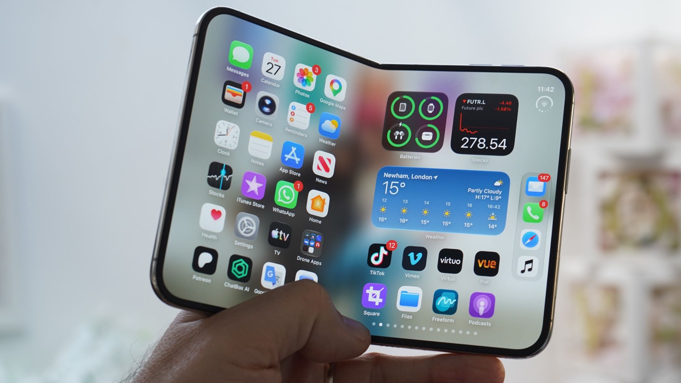 iPhone Duo held in hand half folded