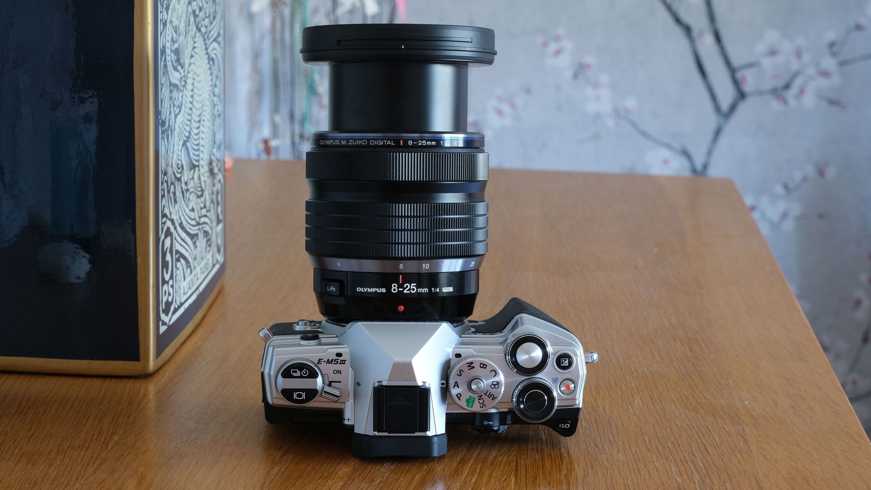 Olympus M.Zuiko Digital ED 8-25mm f/4 PRO on a wooden table