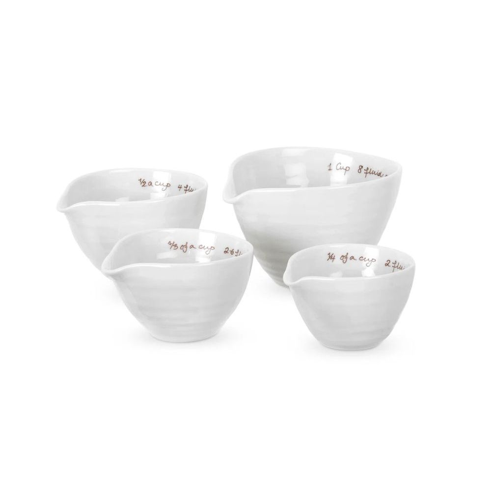 White ceramic measuring cups with red handwritten labels