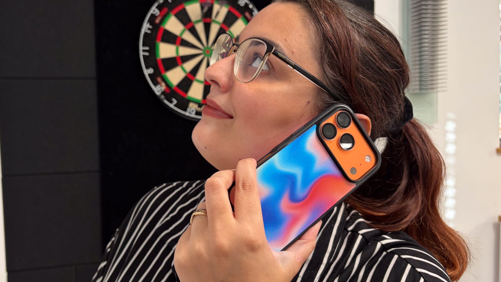 Person using an iPhone in a Smartish Gripmunk iPhone 18 Pro case