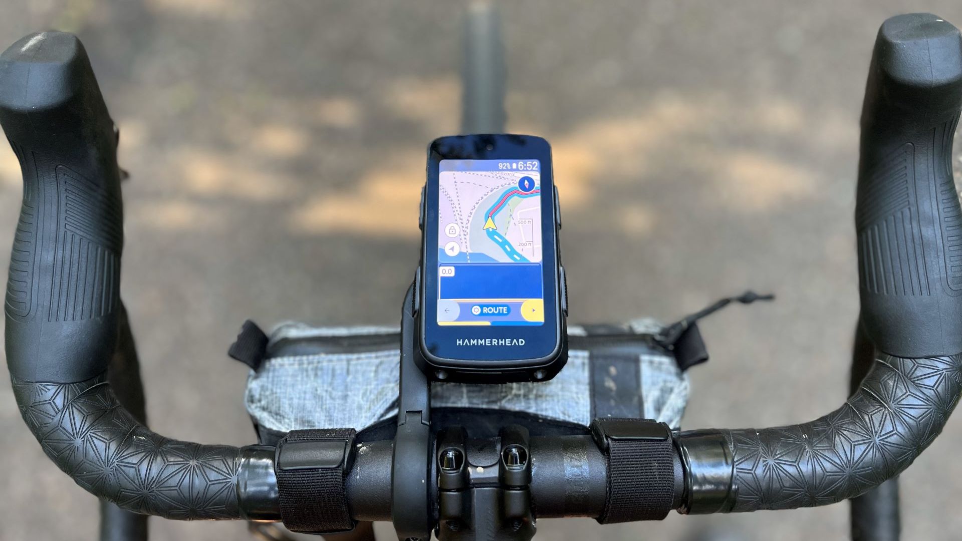Hammerhead Karoo mounted centrally on a handlebar which features Sram Shifters, Supercaz bar tape and a small handlebar bag