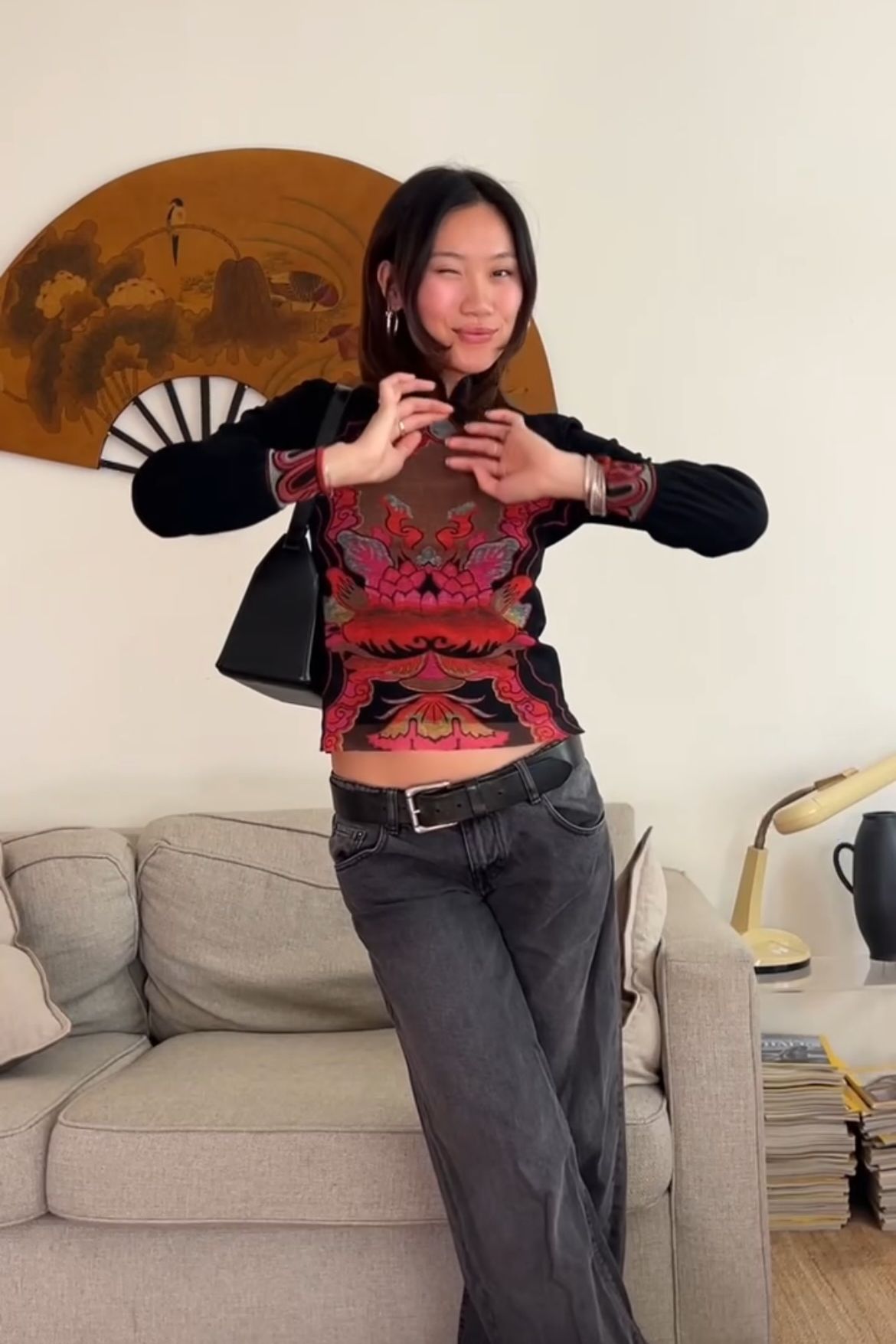 Vivian Li wearing frog closures as part of her outfit