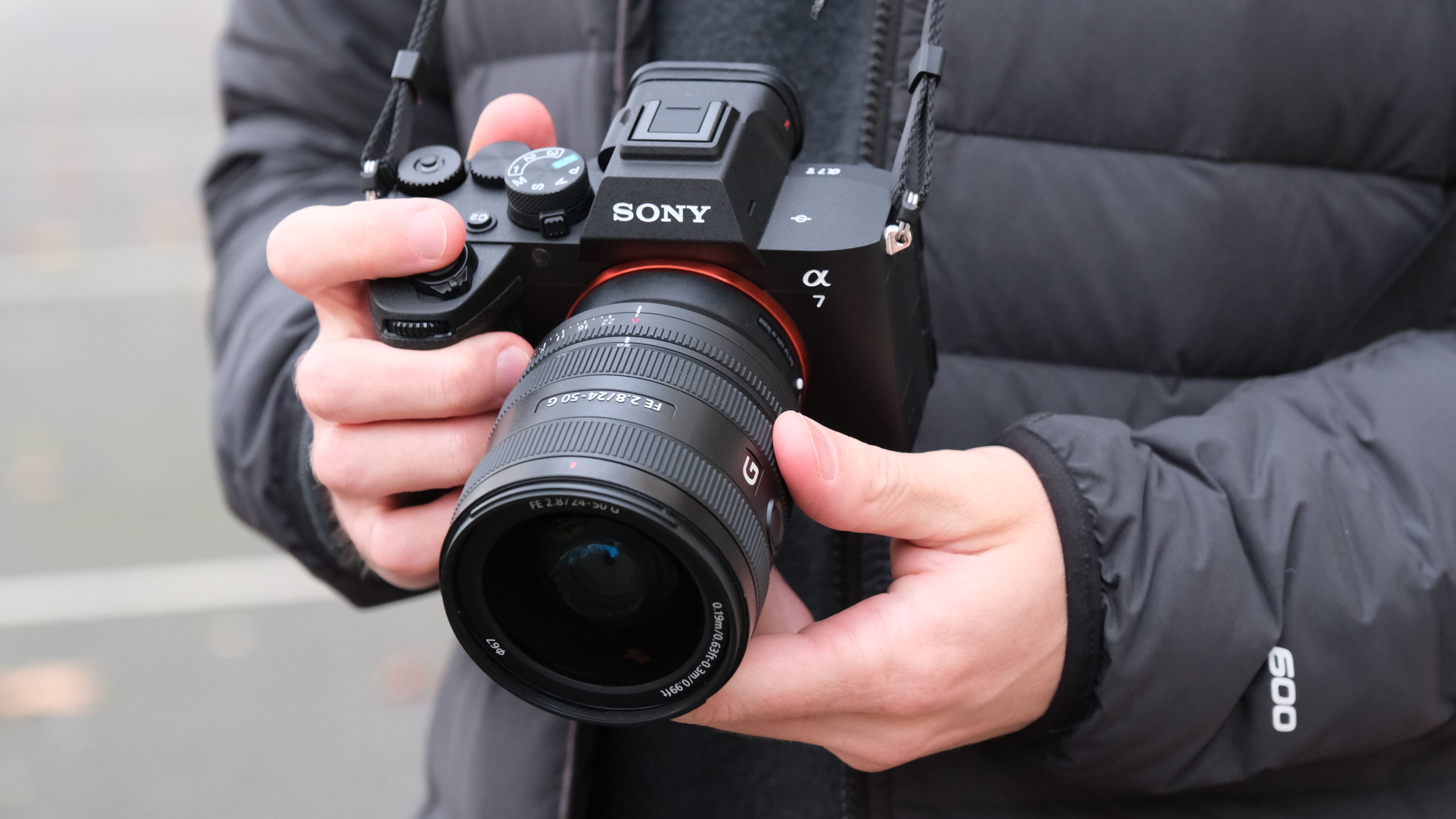 Sony A7 V camera held in a person's hands