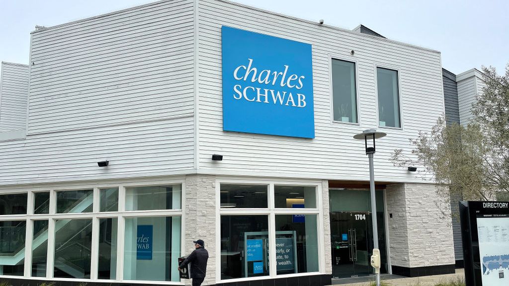 A pedestrian walks by a Charles Schwab office on April 17, 2023 in Corte Madera, California.