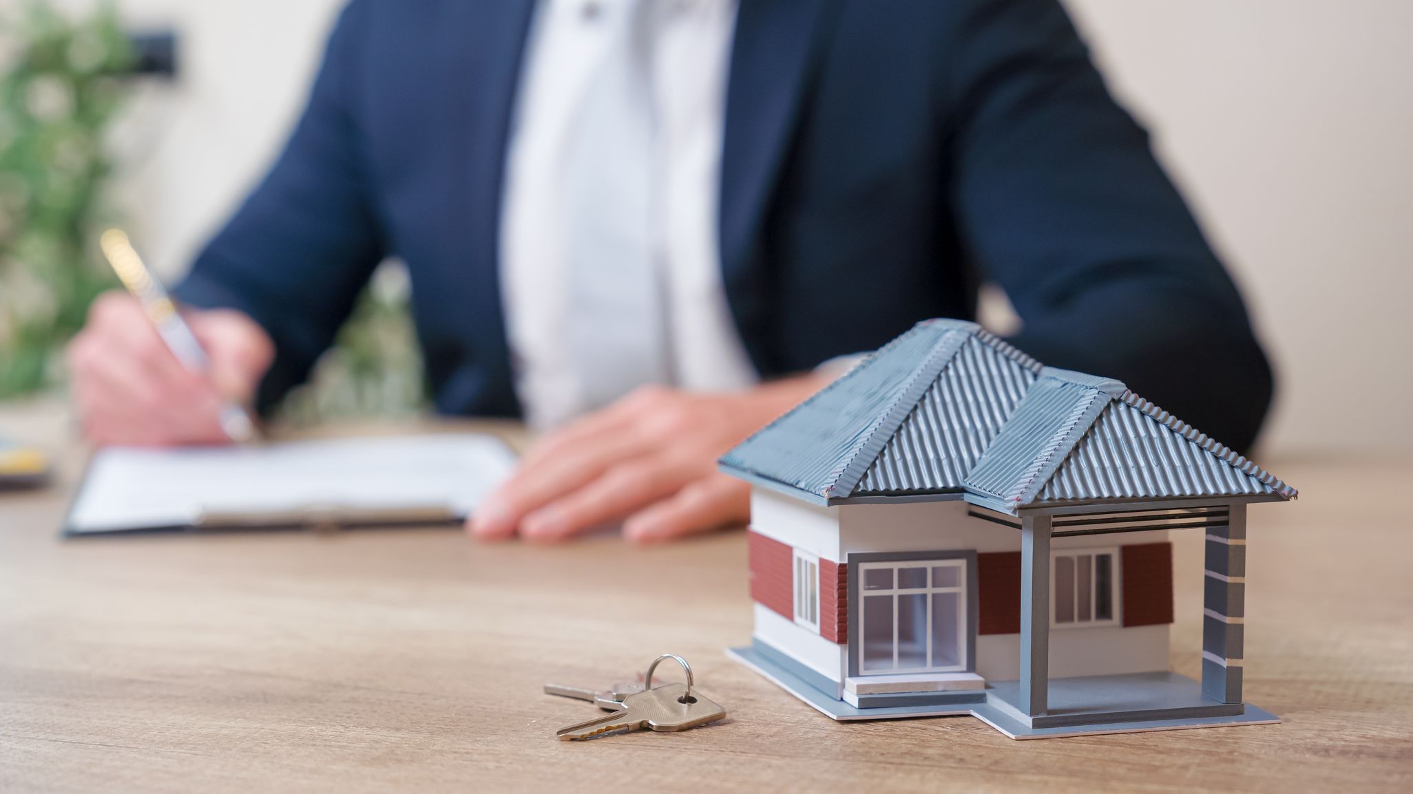 A mortgage broker filling out paperwork