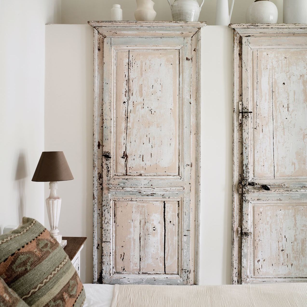 rustic reclaimed doors used on a fitted wardrobe in a bedroom
