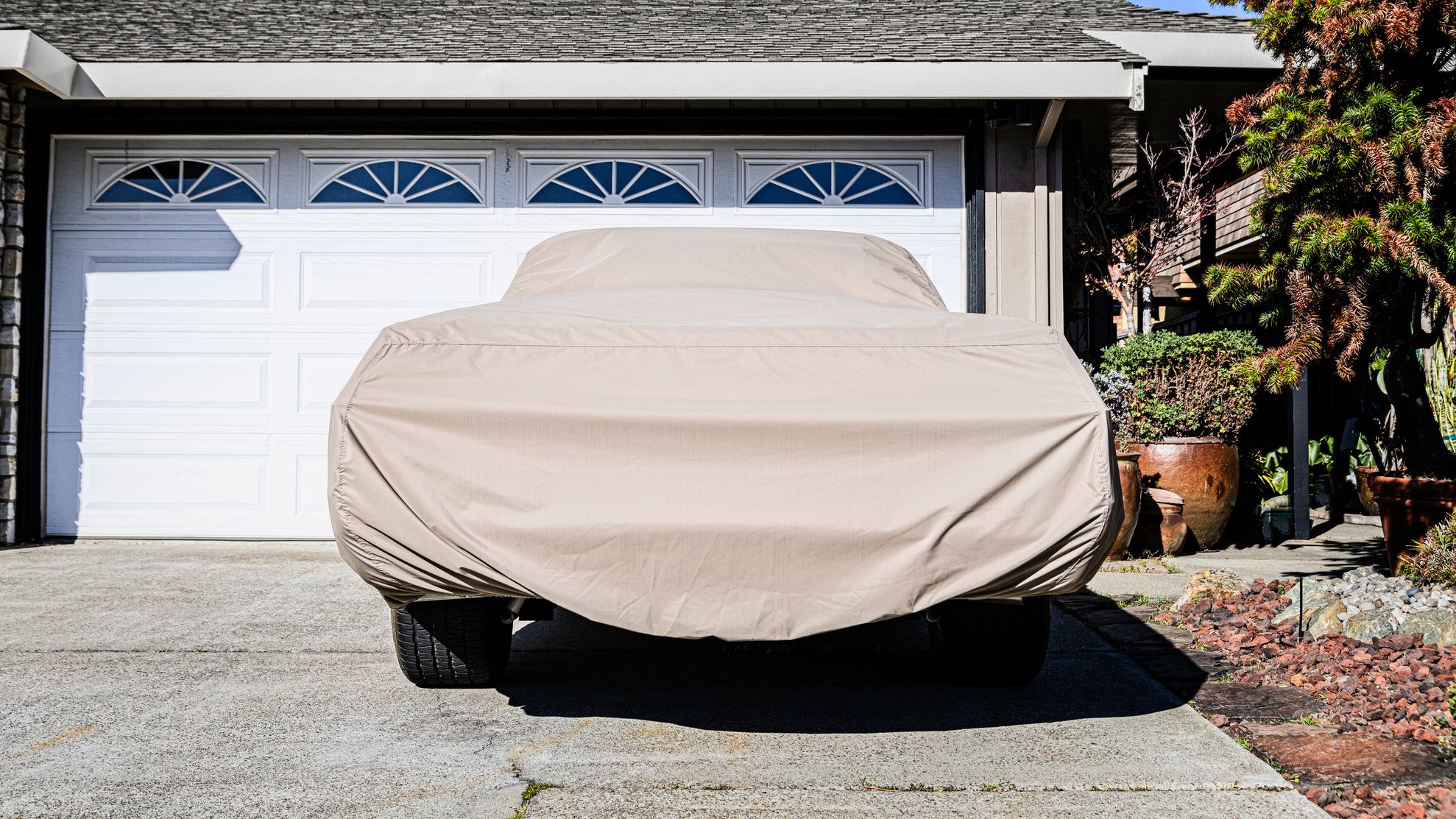 Covered car in a driveway