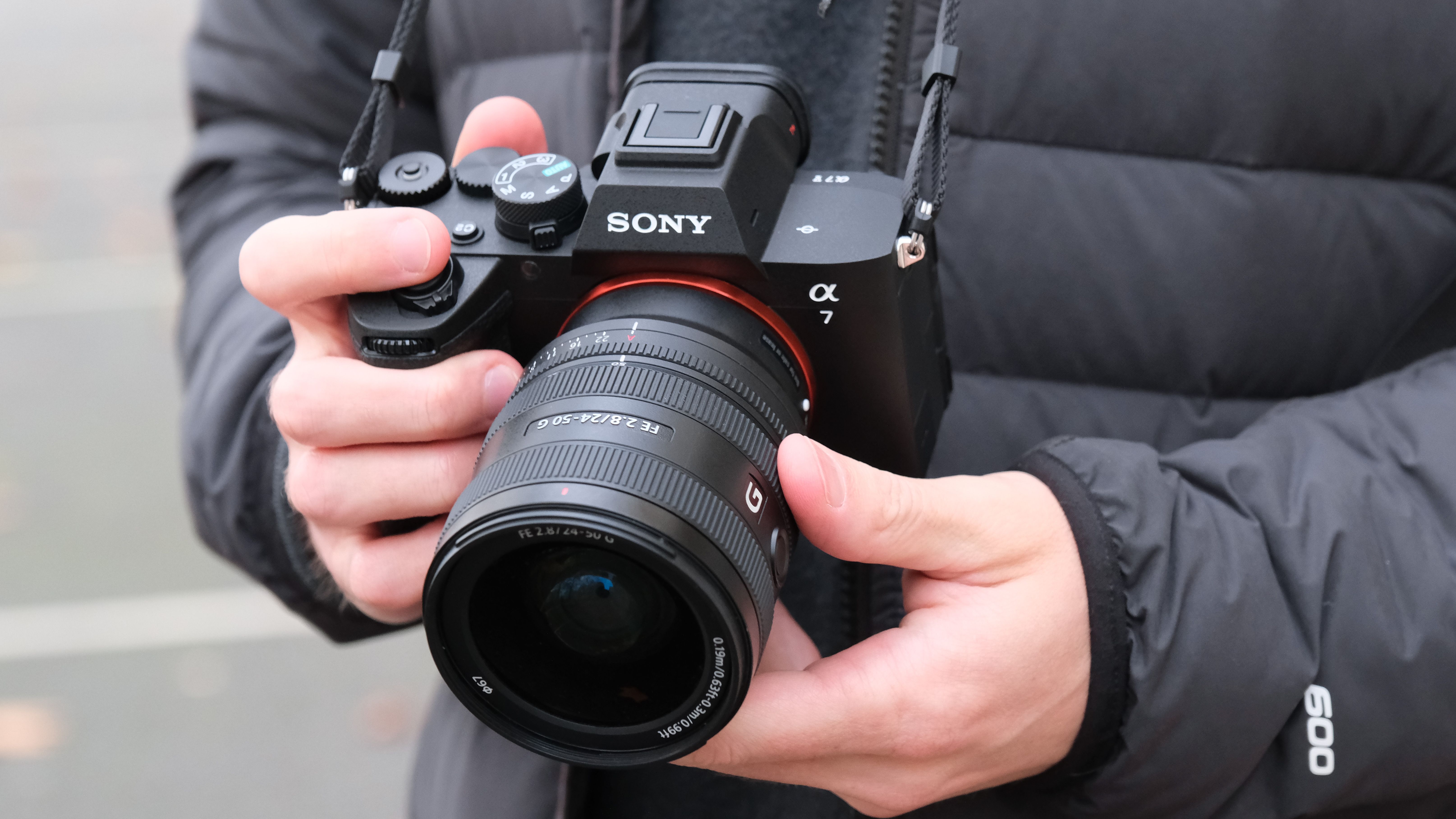 Sony A7 V camera held in a person's hands