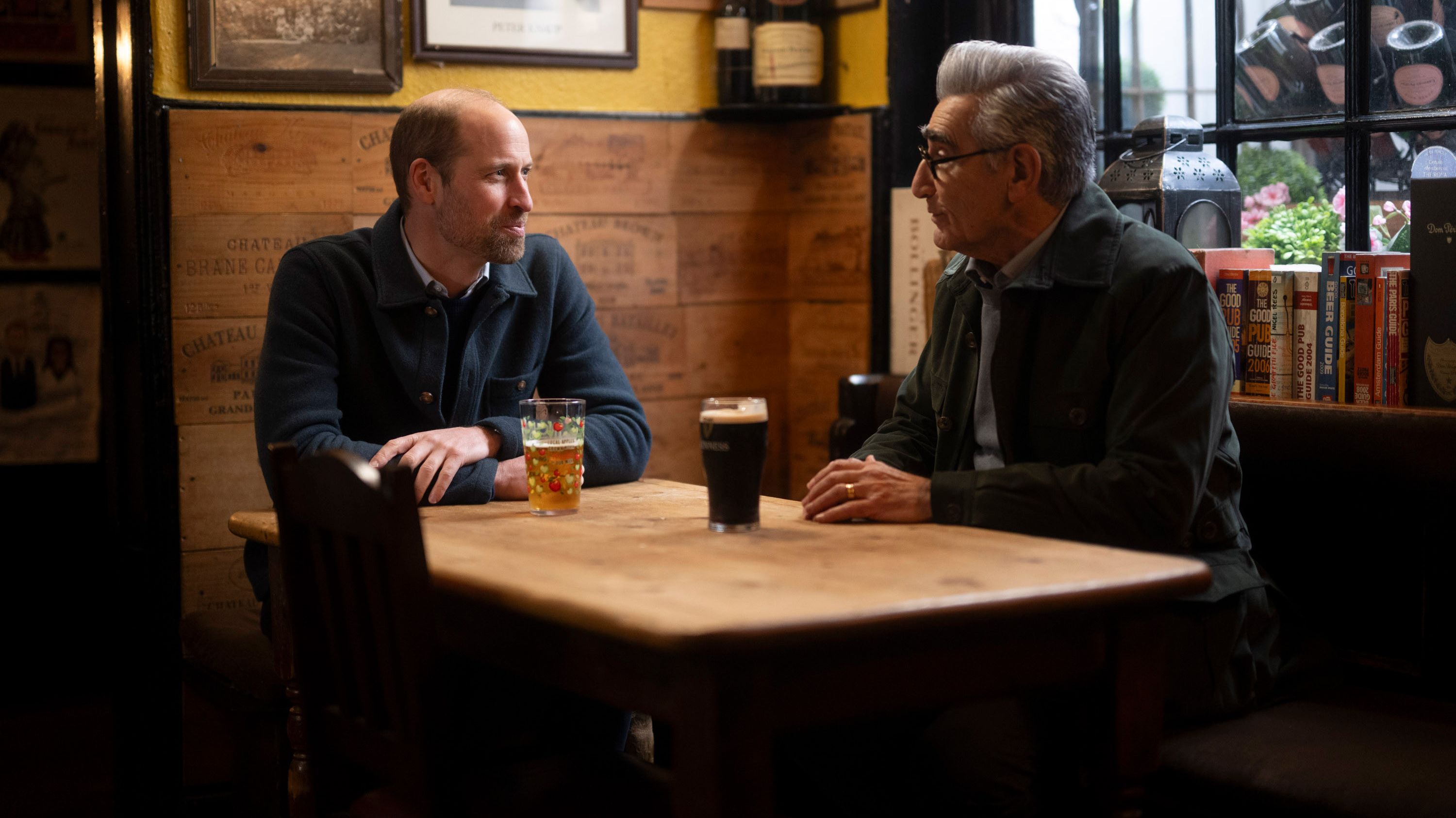 Prince William and Eugene Levy share a pint for the Apple TV series, The Reluctant Traveler