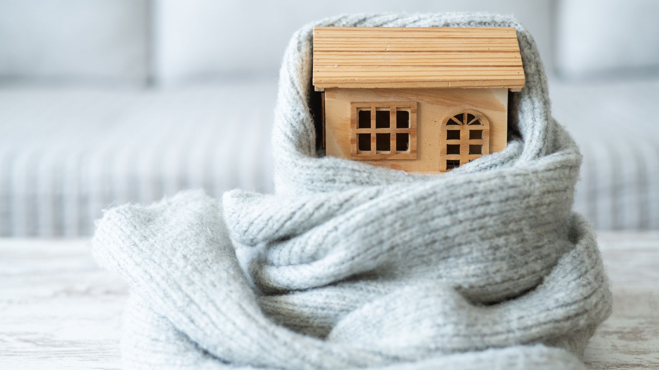 a home wrapped in a blanket indicating healthy insulation