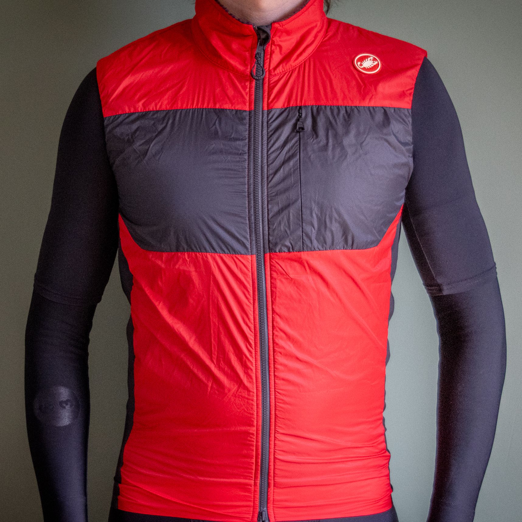 Castelli Unlimited Puffy Vest in red and black pictured against a plain grey background
