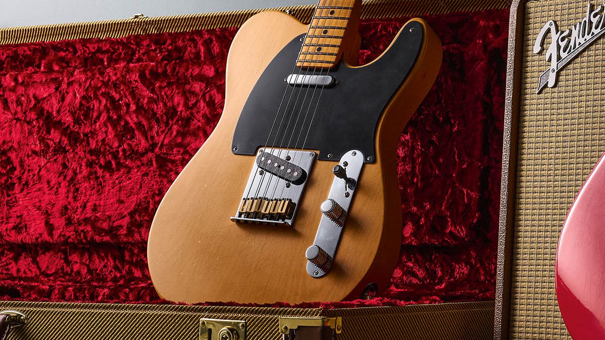 Fender American Ultra Luxe Vintage '50s Telecaster and Vintage '60s Stratocaster HSS photographed against a Fender combo and their tweed-covered case.