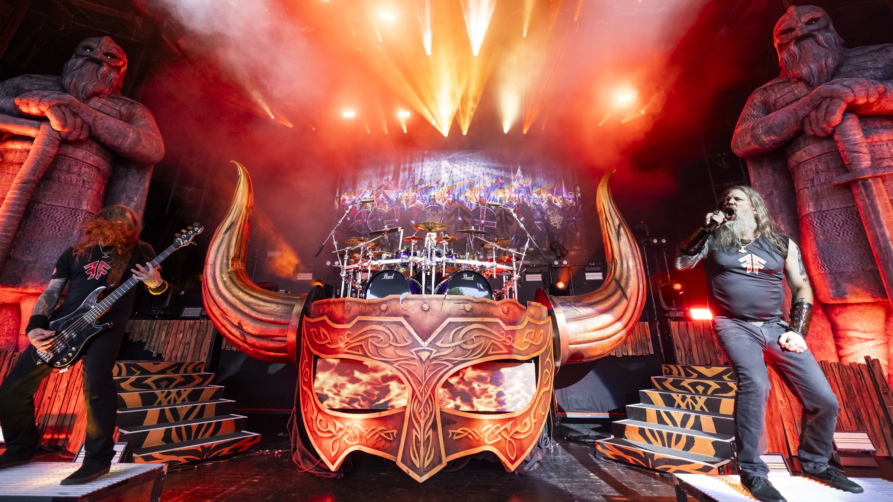 CLARKSTON, MICHIGAN - JULY 17: (L-R) Ted Lundstr&amp;ouml;m, Jocke Wallgren and Johan Hegg of Amon Amarth performs at Pine Knob Music Theatre on July 17, 2025 in Clarkston, Michigan. (Photo by Scott Legato/Getty Images)
