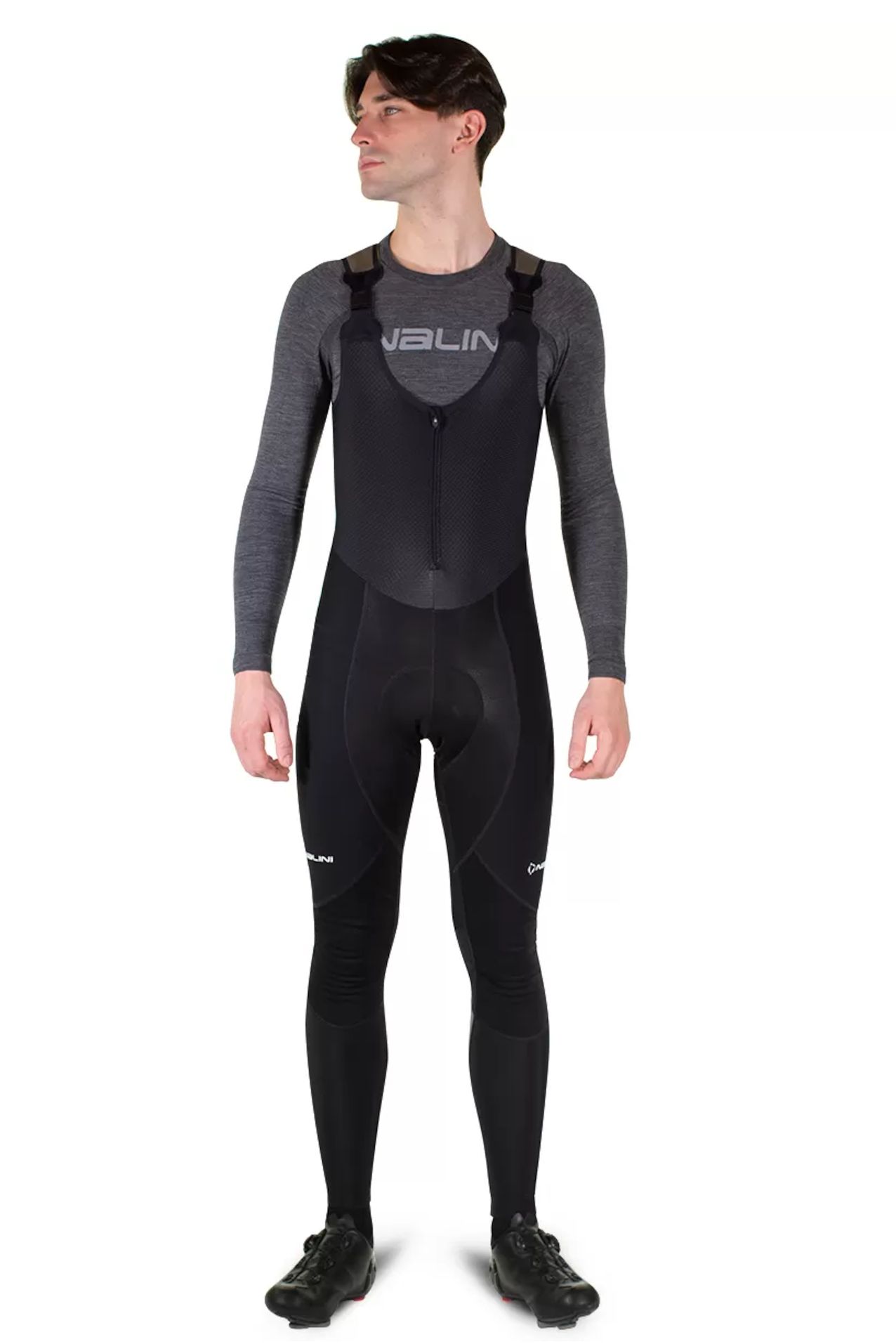 A cyclist wearing a pair of Nalini Ergo X Warm bib tights 