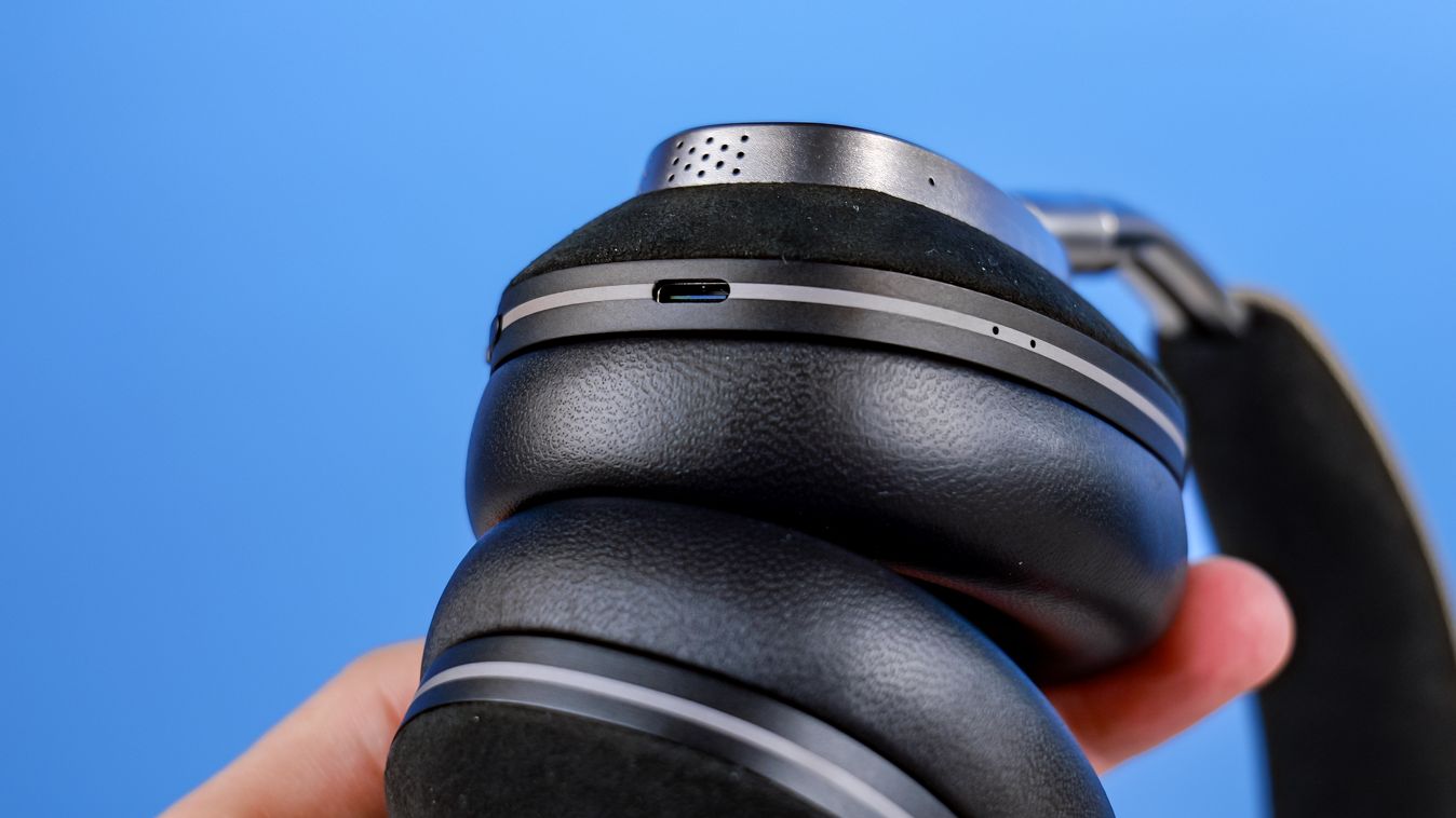 The Noble Audio FoKus Artemis in hand showing the USB-C port