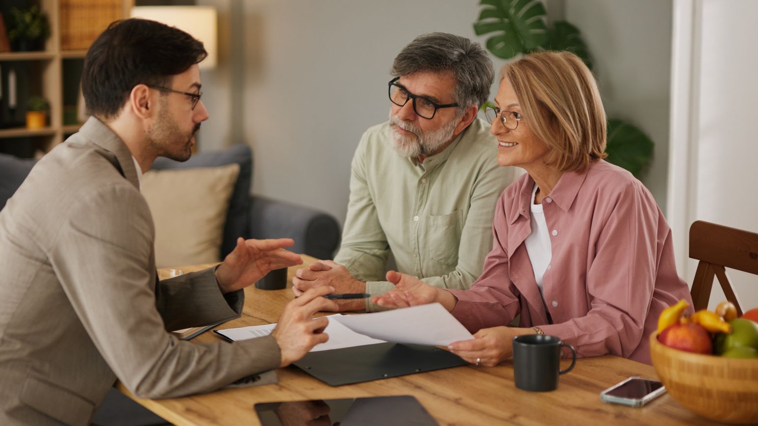 Financial advisor discussing life insurance with senior couple