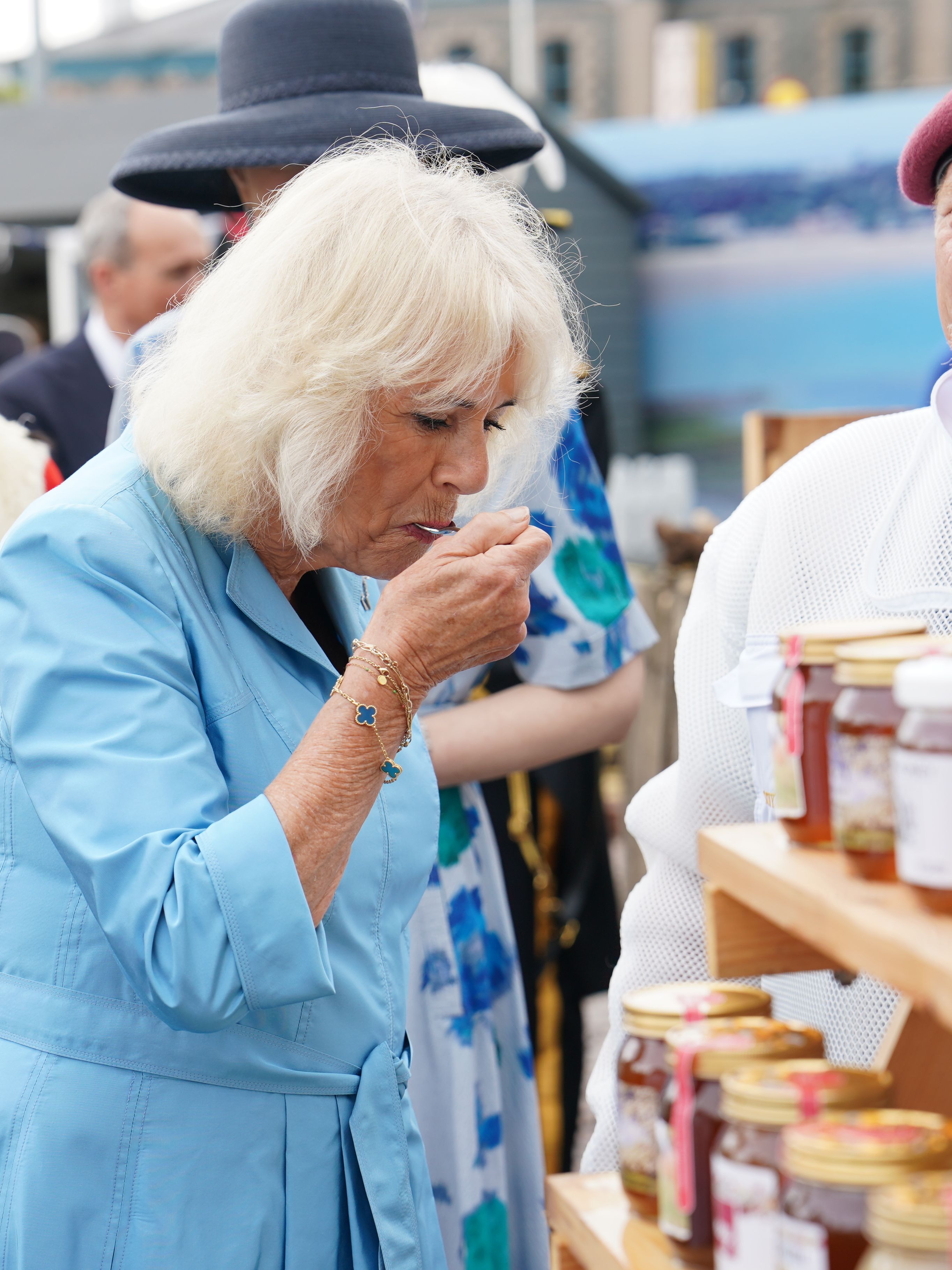 The Queen tries some honey