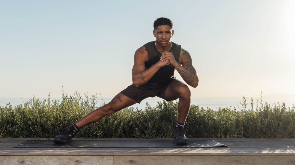 Man demonstrates exercise in gym