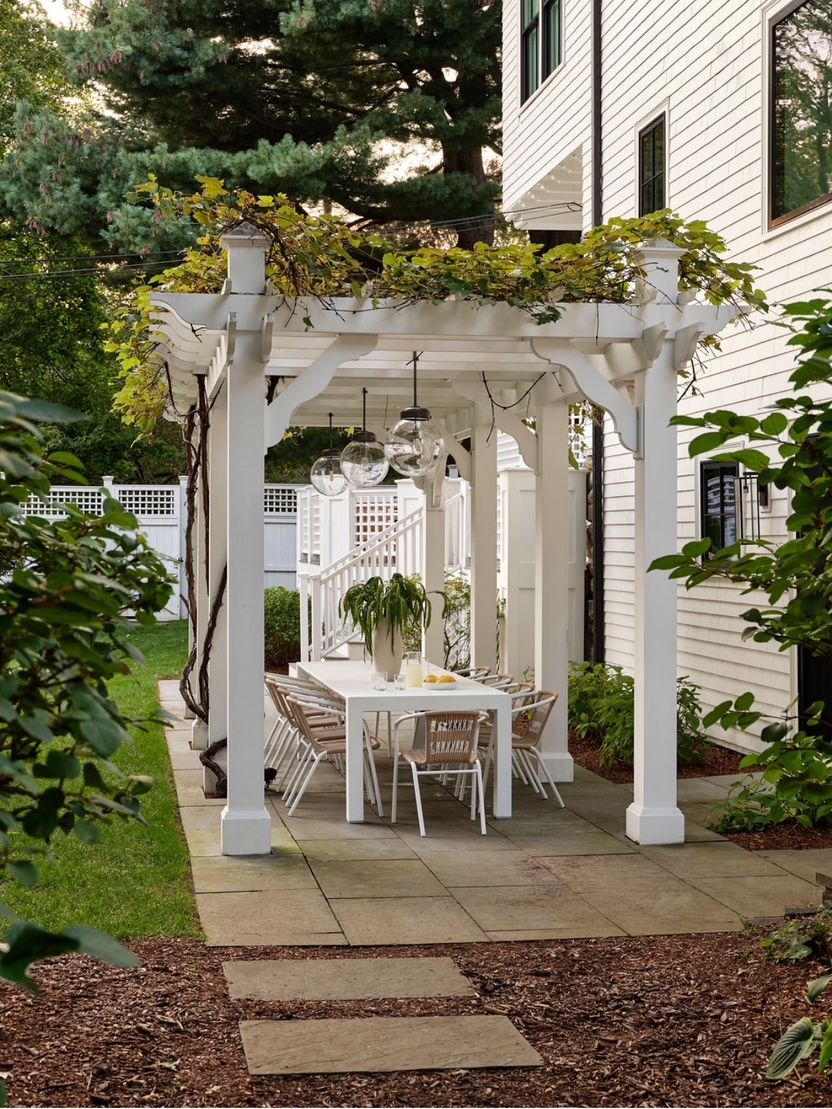 outdoor dining area under a pergola
