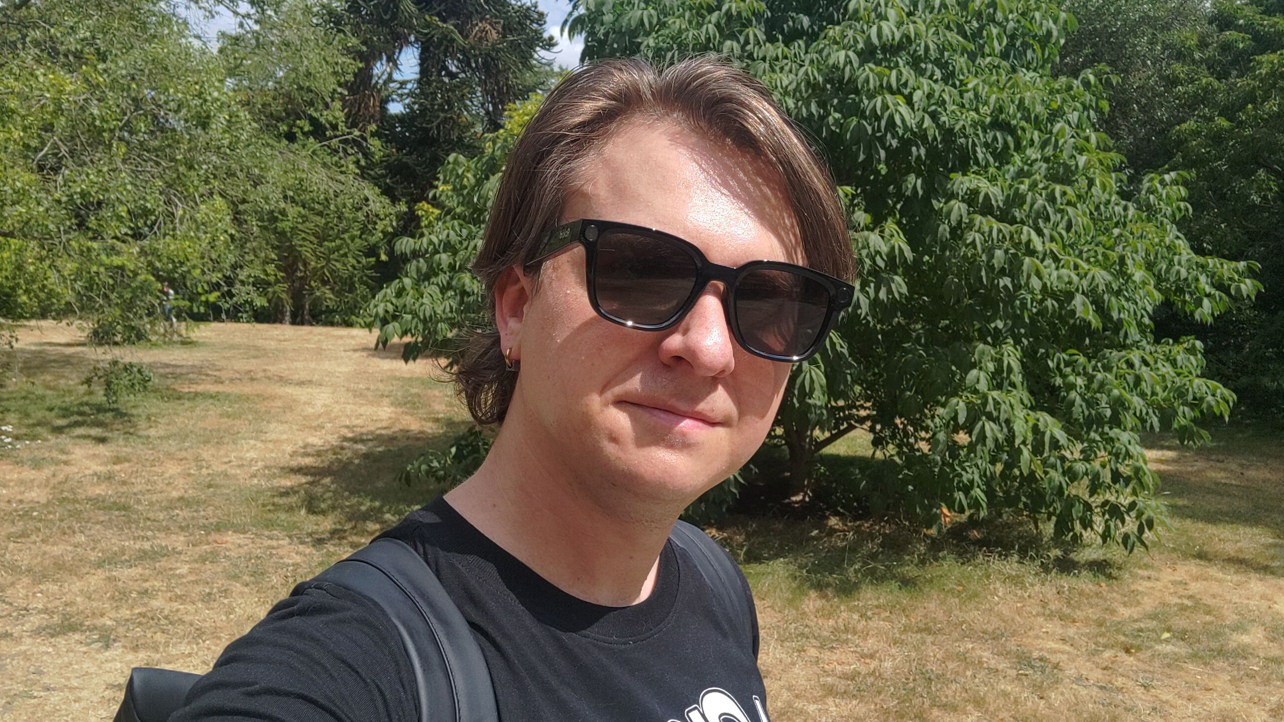 Photograph of a man wearing Rokid AI Glasses Style