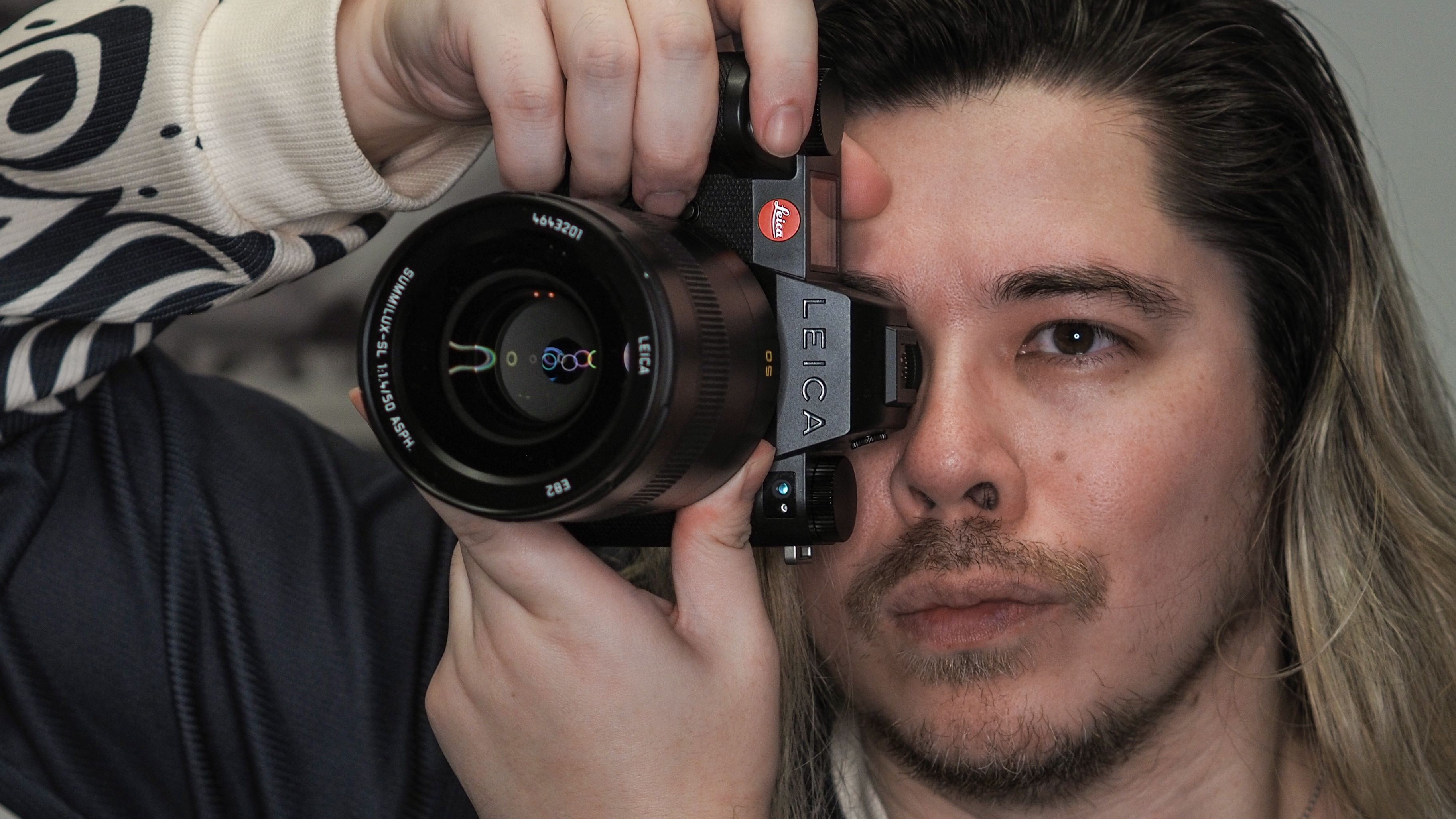 Leica SL3-S on a wooden surface with moody lighting