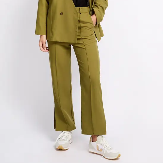 green tailored trousers