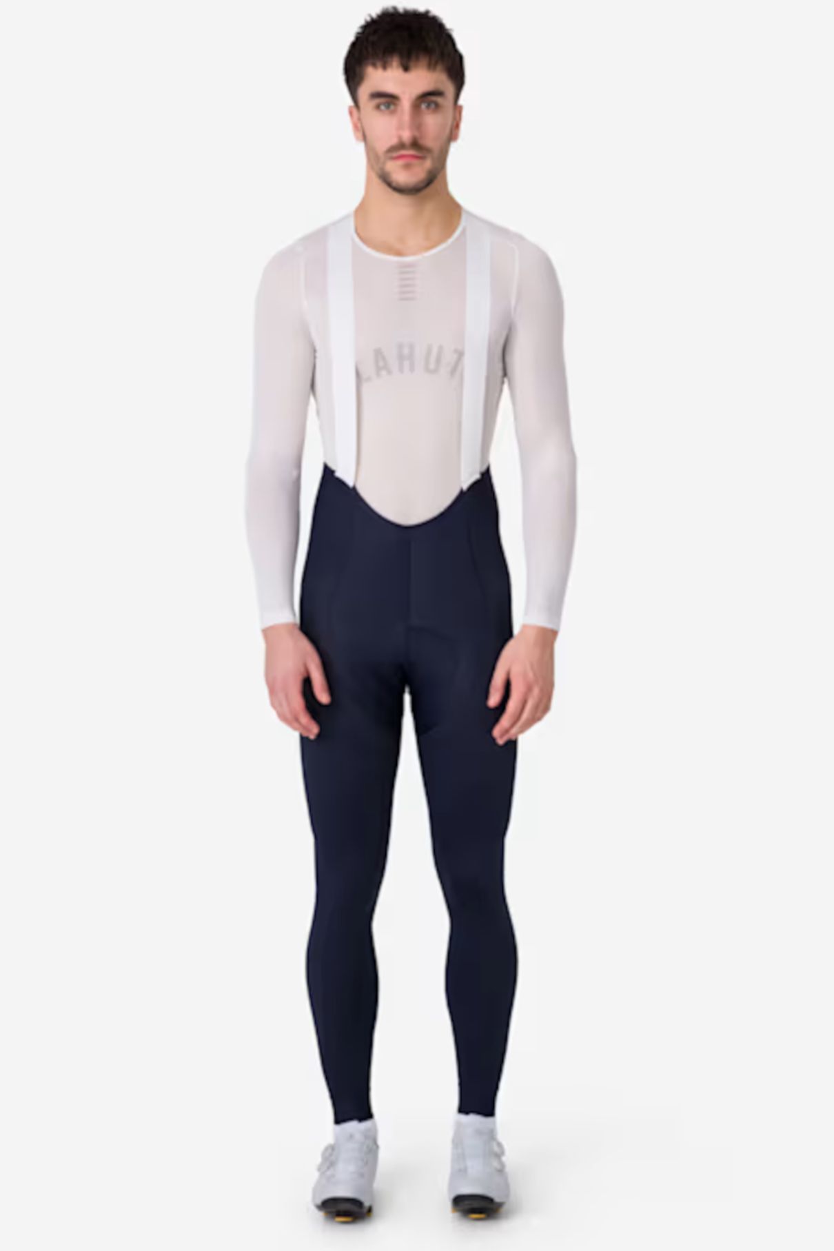 A cyclist wearing a pair of Rapha Pro Team lightweight bib tights