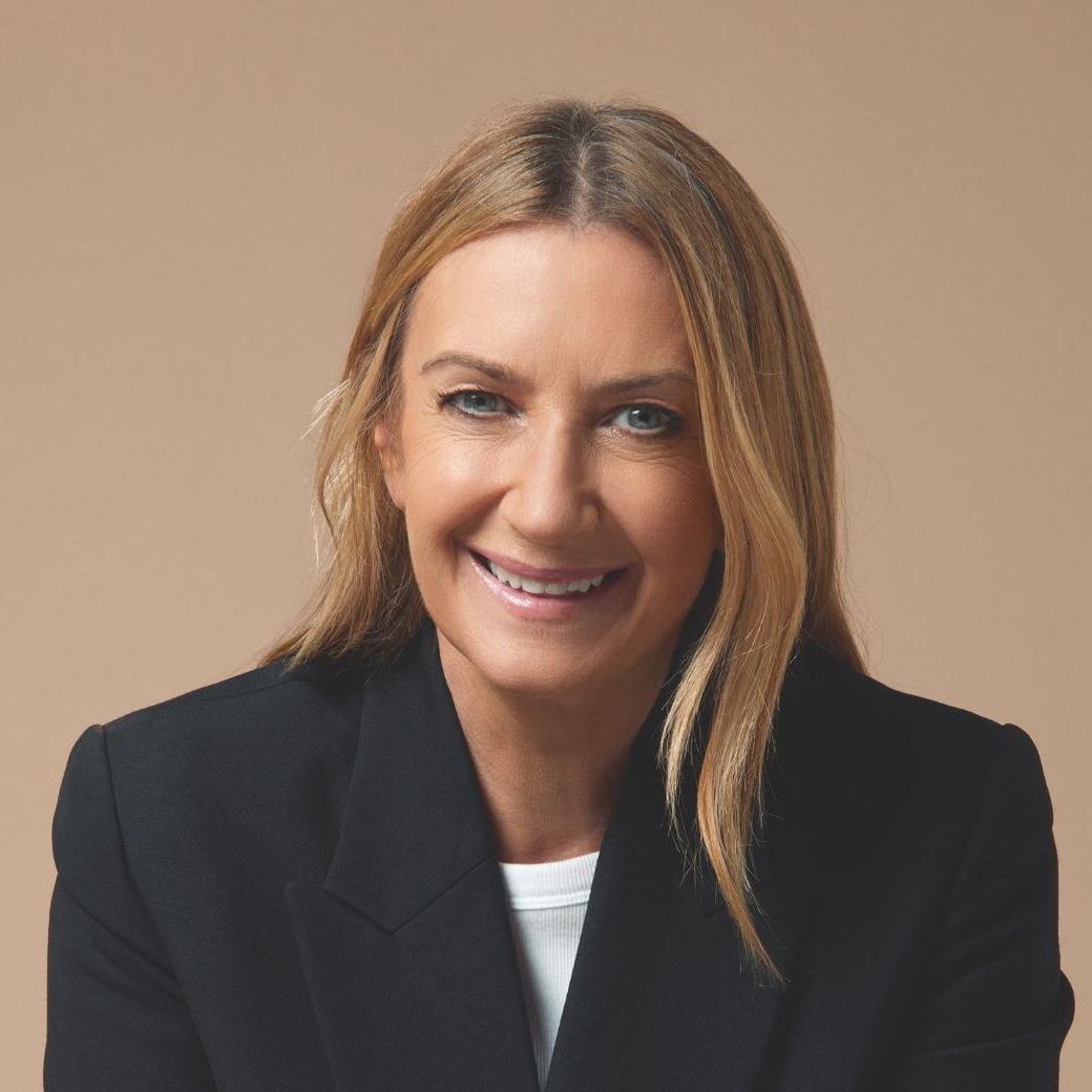 Anya Hindmarch gold bag; potrait shot of Anya Hindmarch and Anya Hindmarch red luggage on red leather car seats