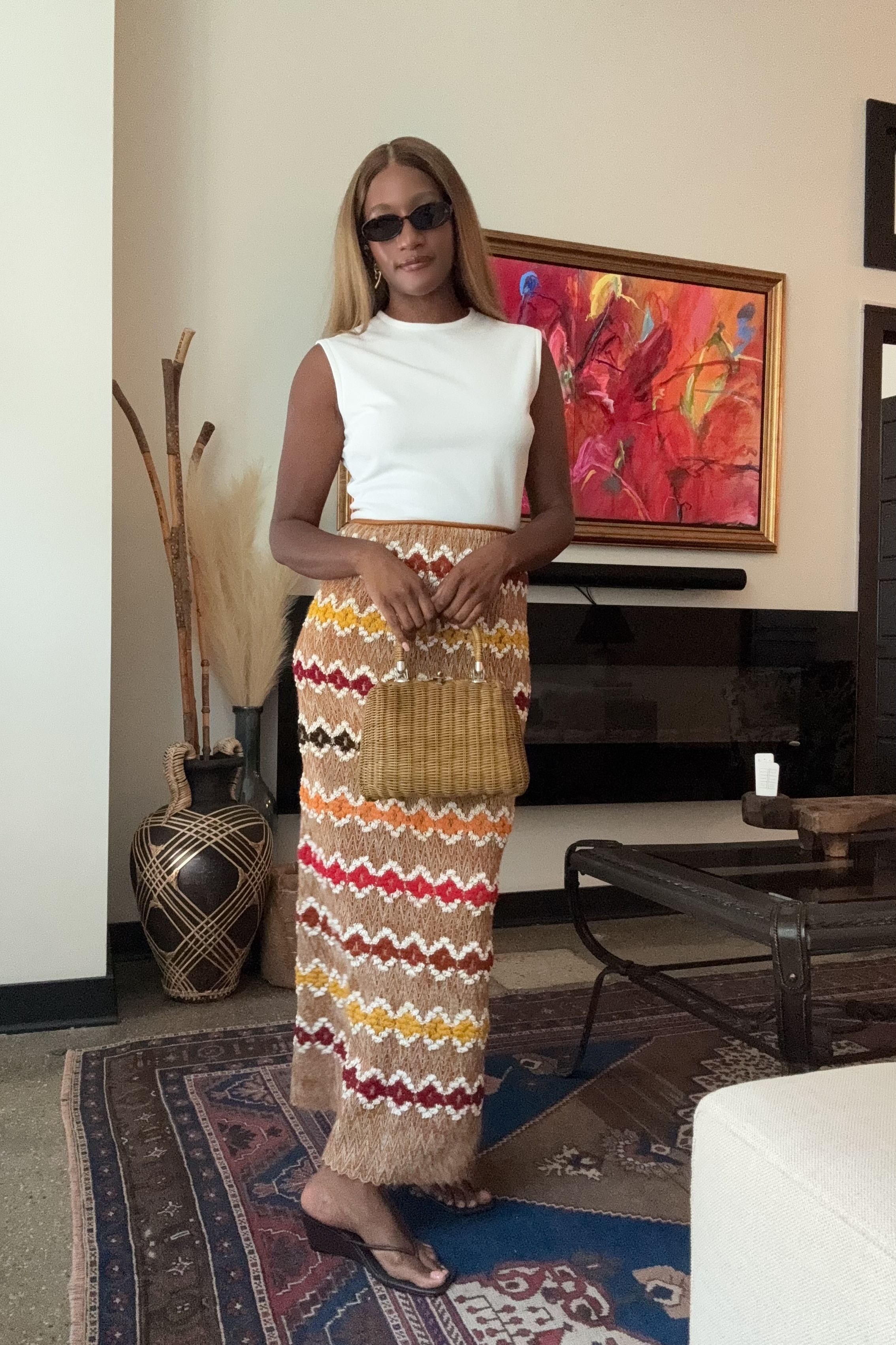 Danielle Prescod demonstrates how to style wedges for summer in a colorful knit skirt